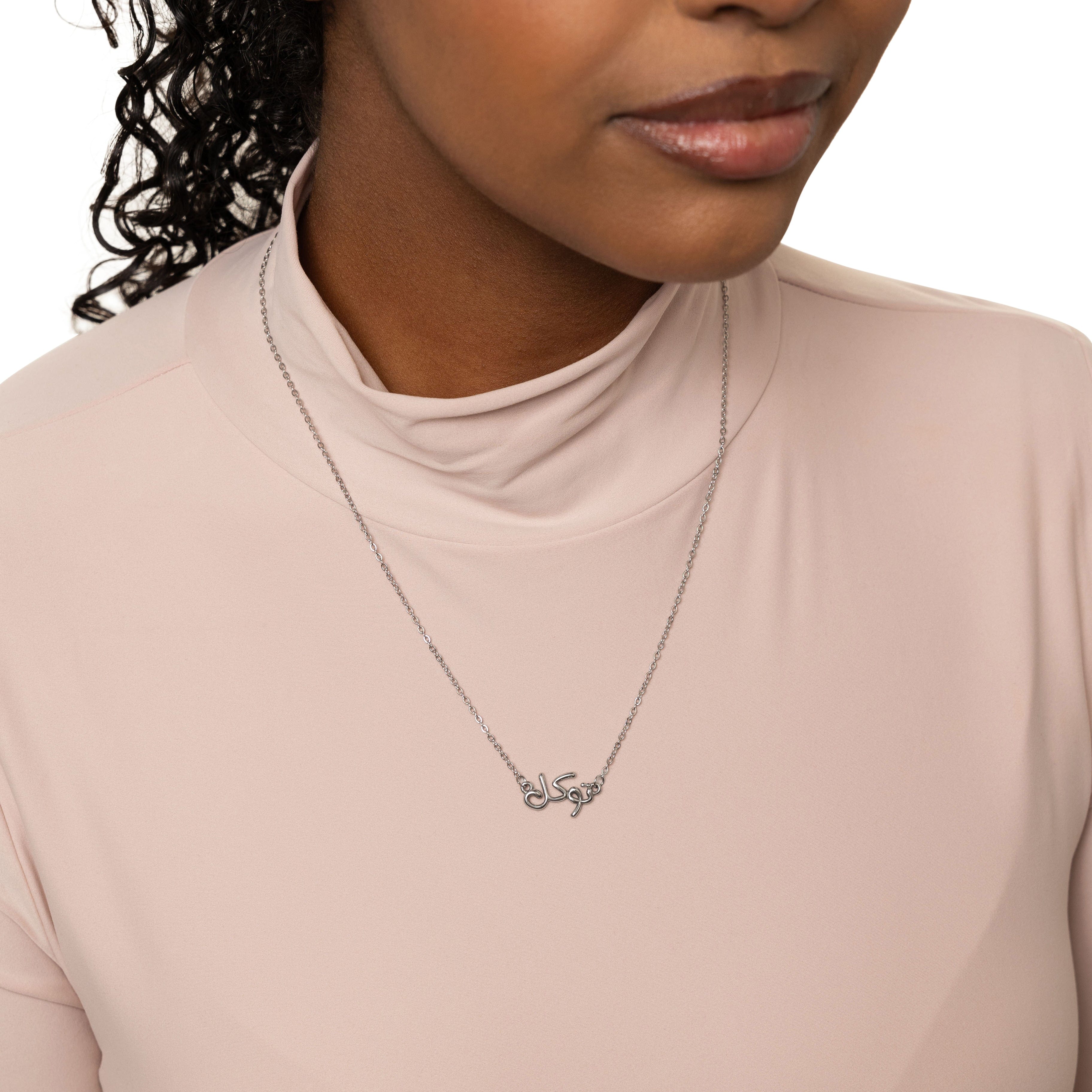Model wearing the gold bubble necklace with Tawakkul, highlighting its elegant look.