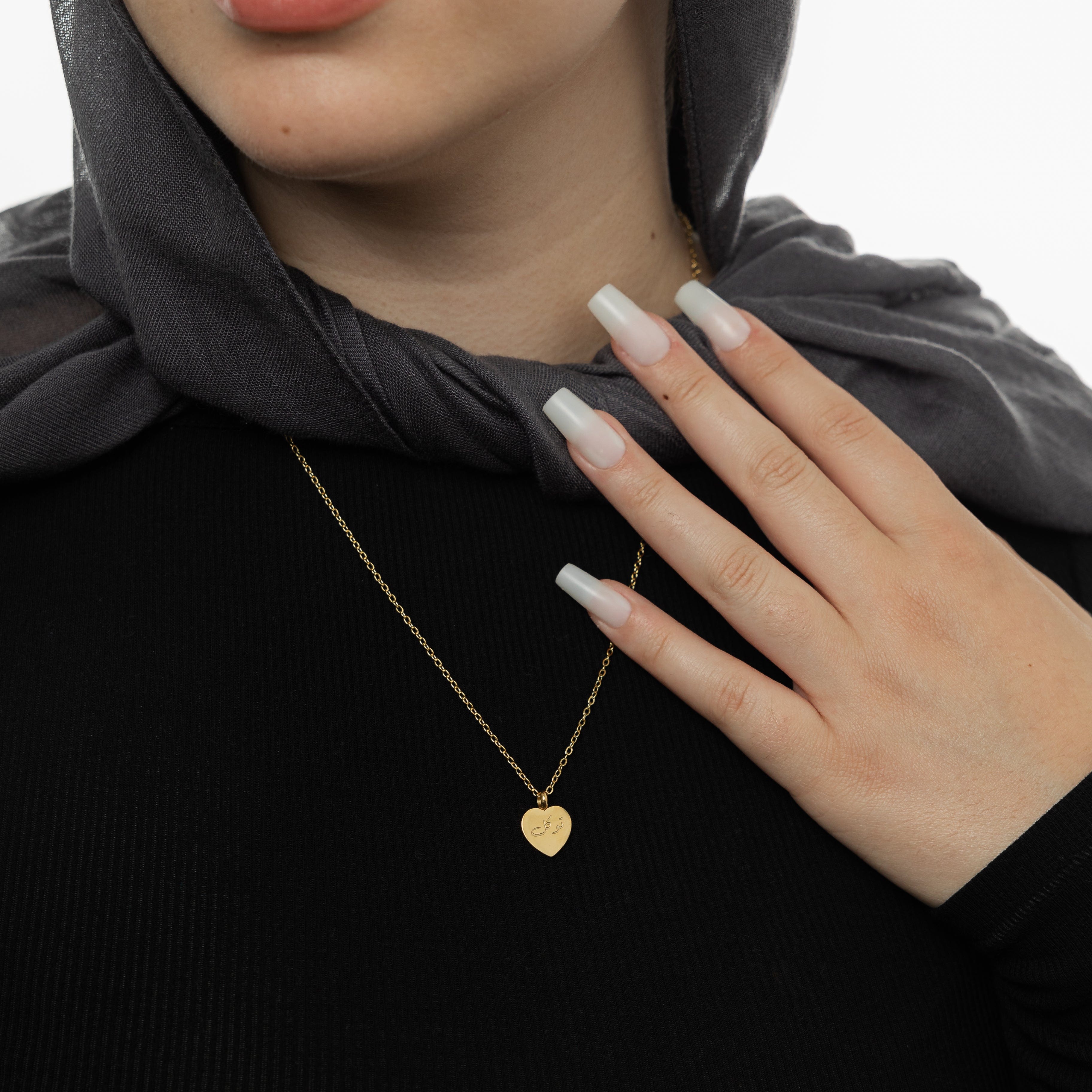 Close-up of the pendant on the Eternal Trust Charm Necklace, emphasizing the craftsmanship and details.