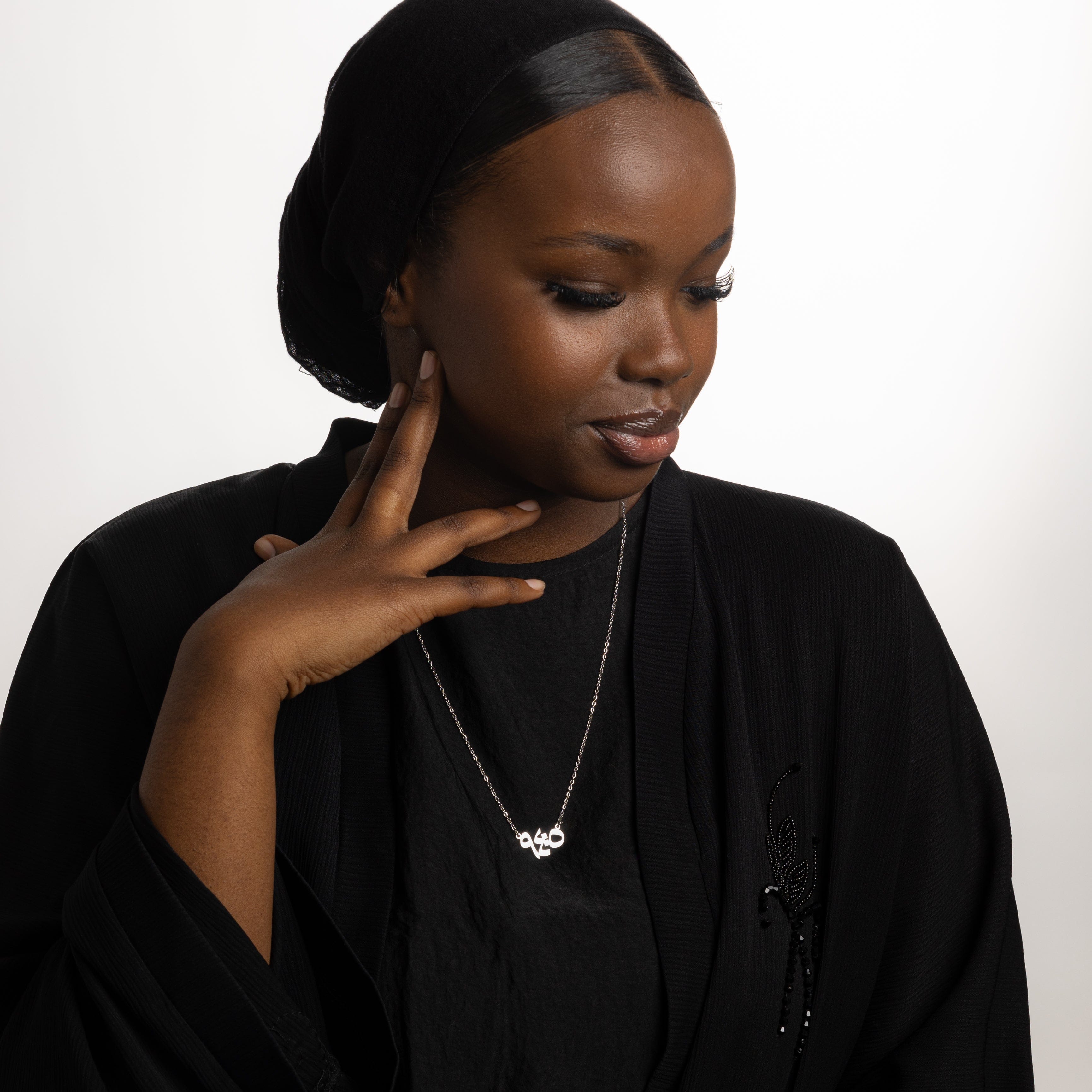 Model wearing the Embrace Serenity verse necklace, highlighting its elegance and inspirational message