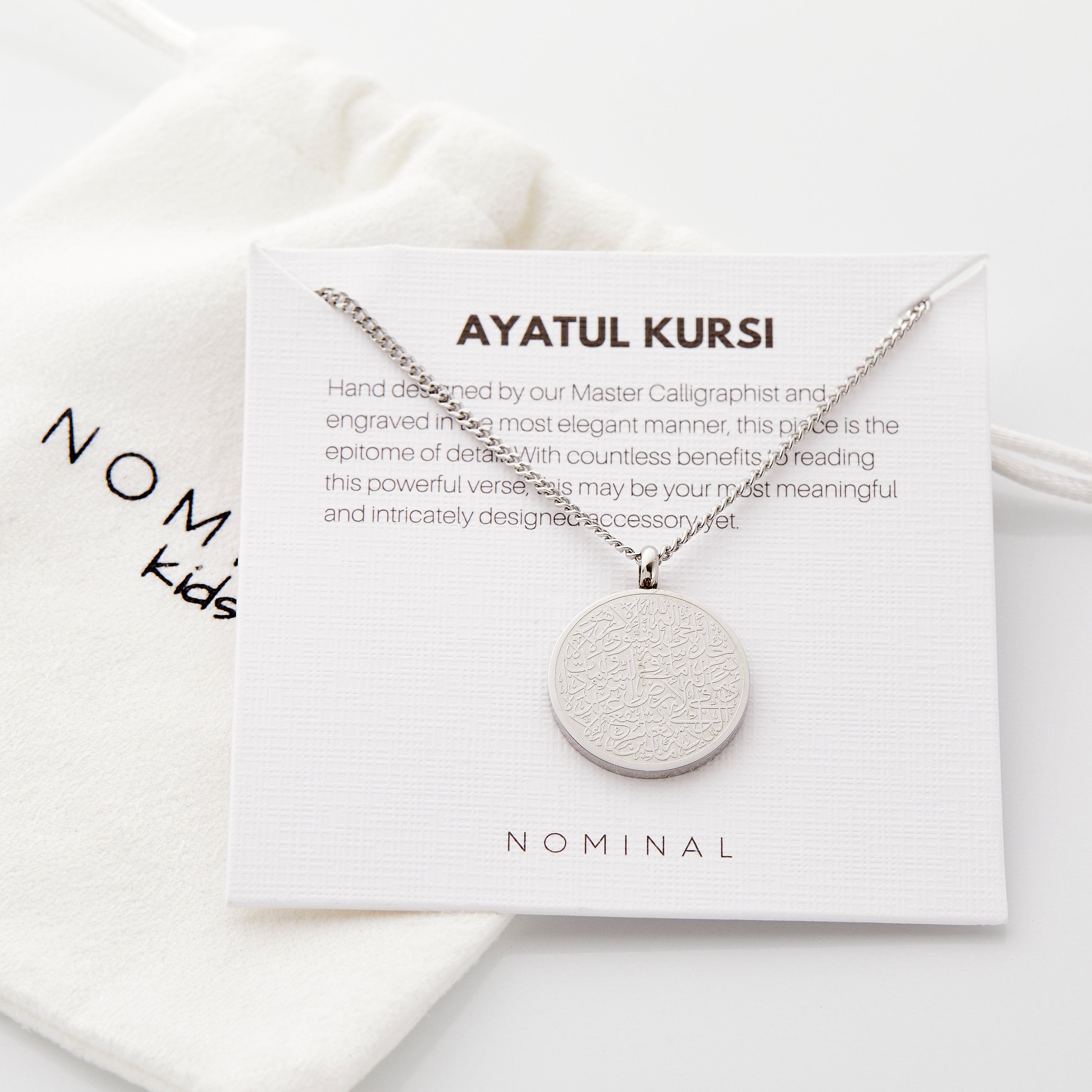 Children wearing the Ayatul Kursi necklace, demonstrating its beauty and significance.