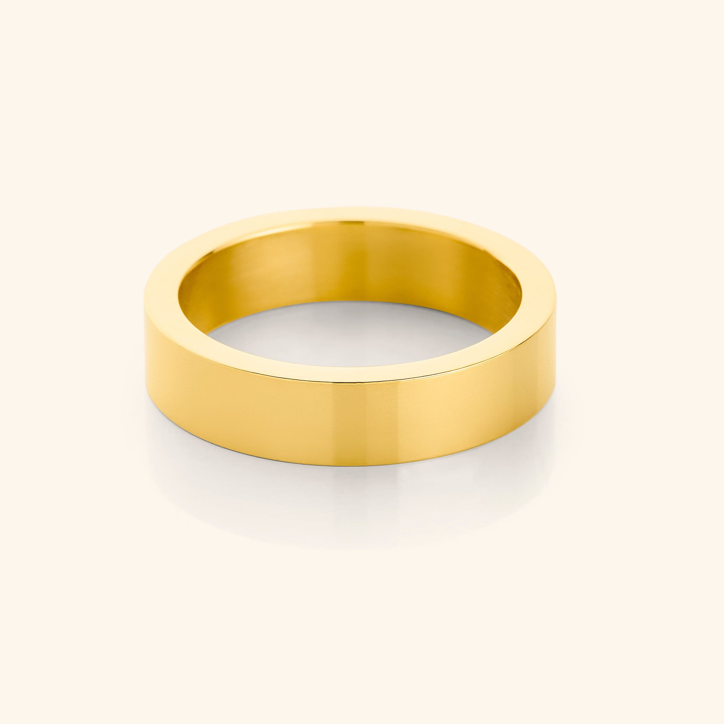 Close-up view of the Bold Essentials Statement Ring showcasing its gold-dipped finish and sleek design.