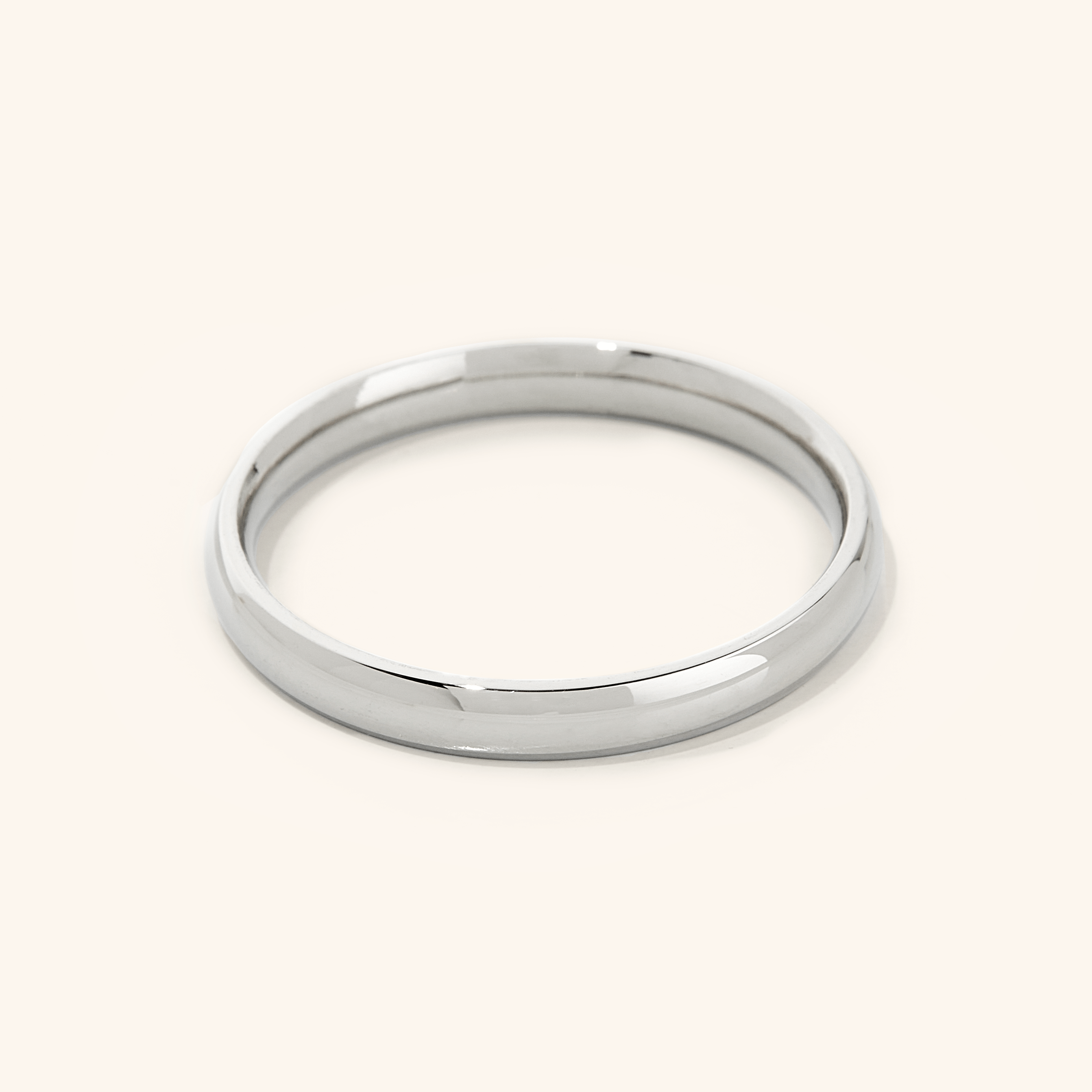 Thin gold ring in velvet drawstring pouch, perfect gift packaging