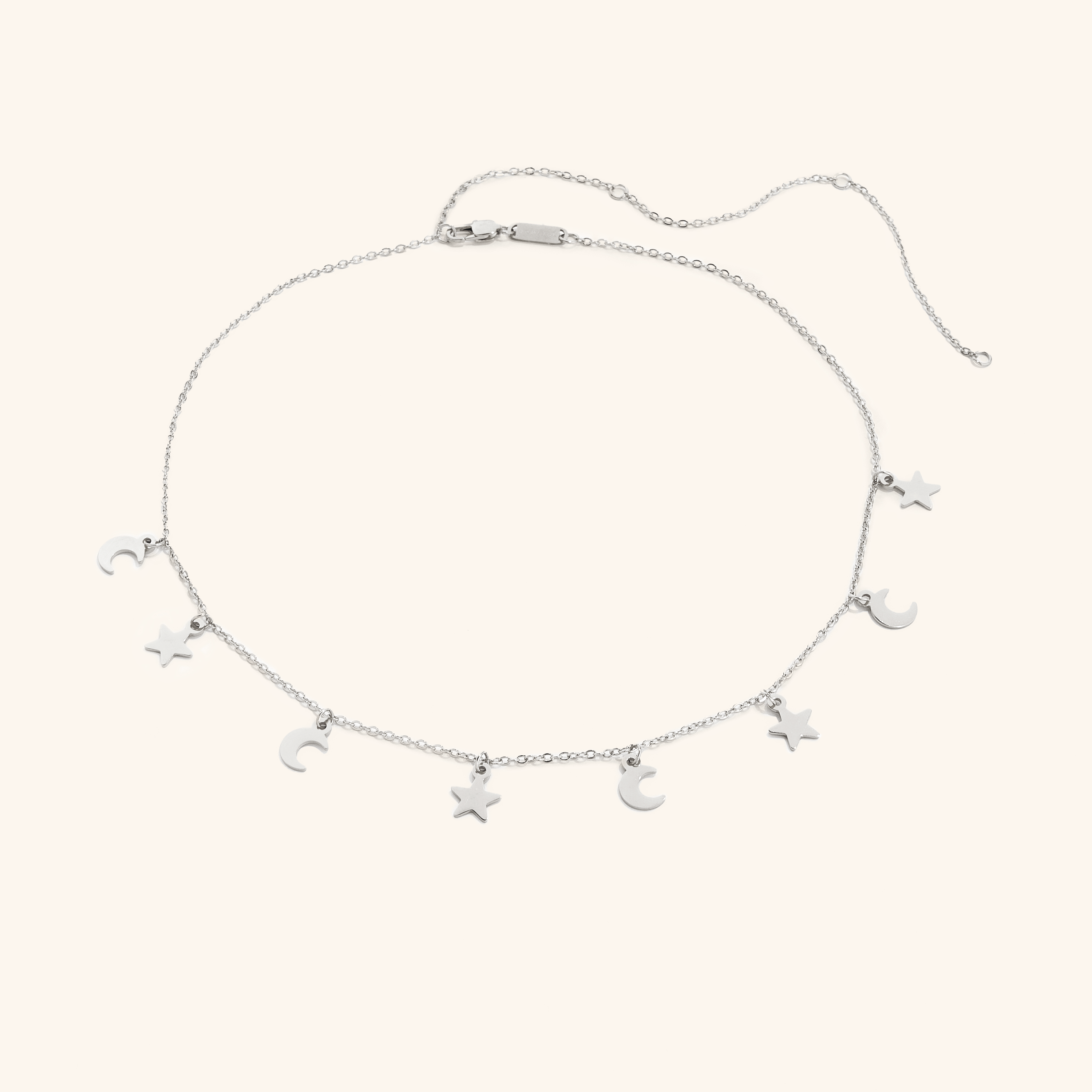 Celestial Charm Layered Choker Necklace showcased on a model, featuring moon and star charms.