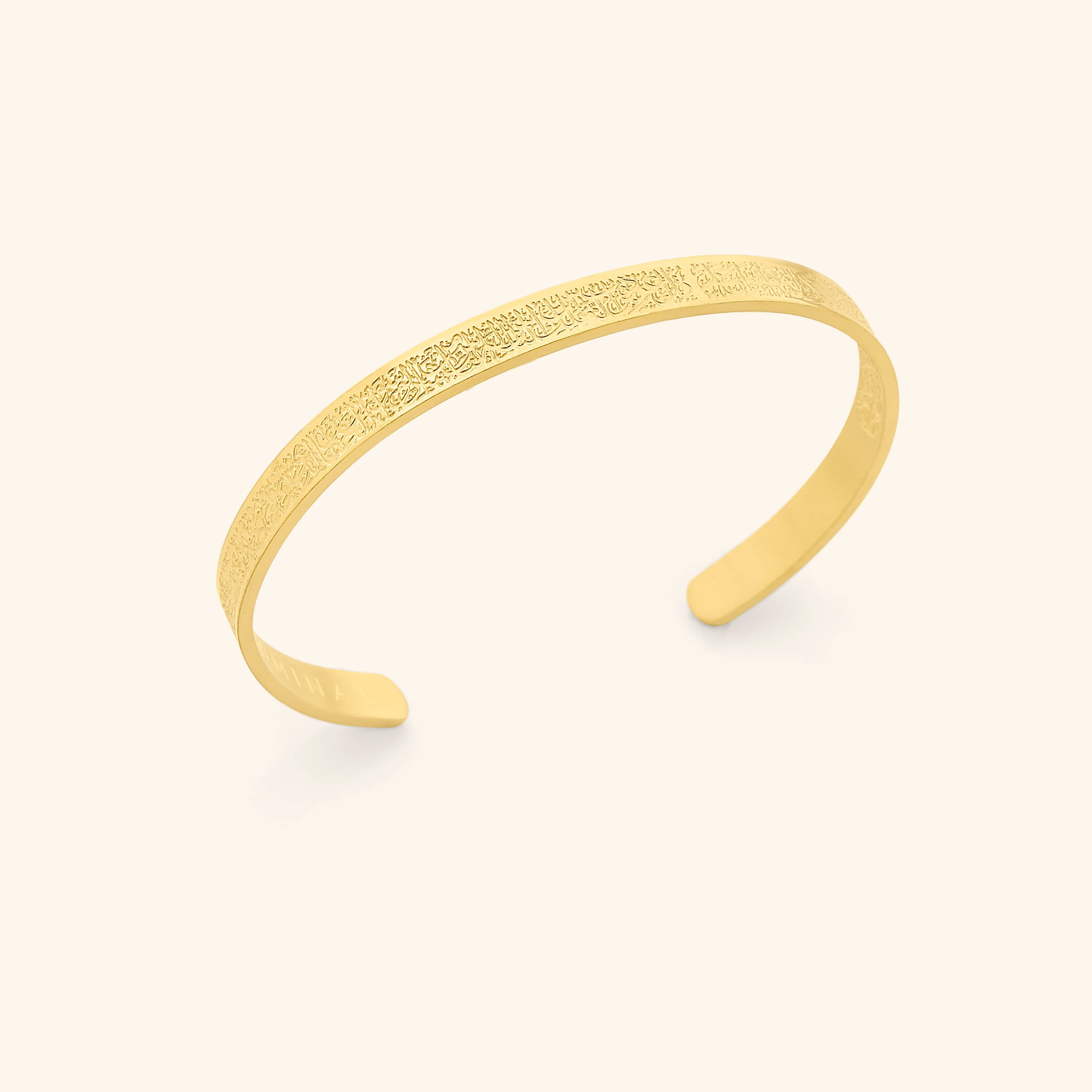 Elegant adjustable cuff bracelet showcasing Quranic surahs from a side angle.