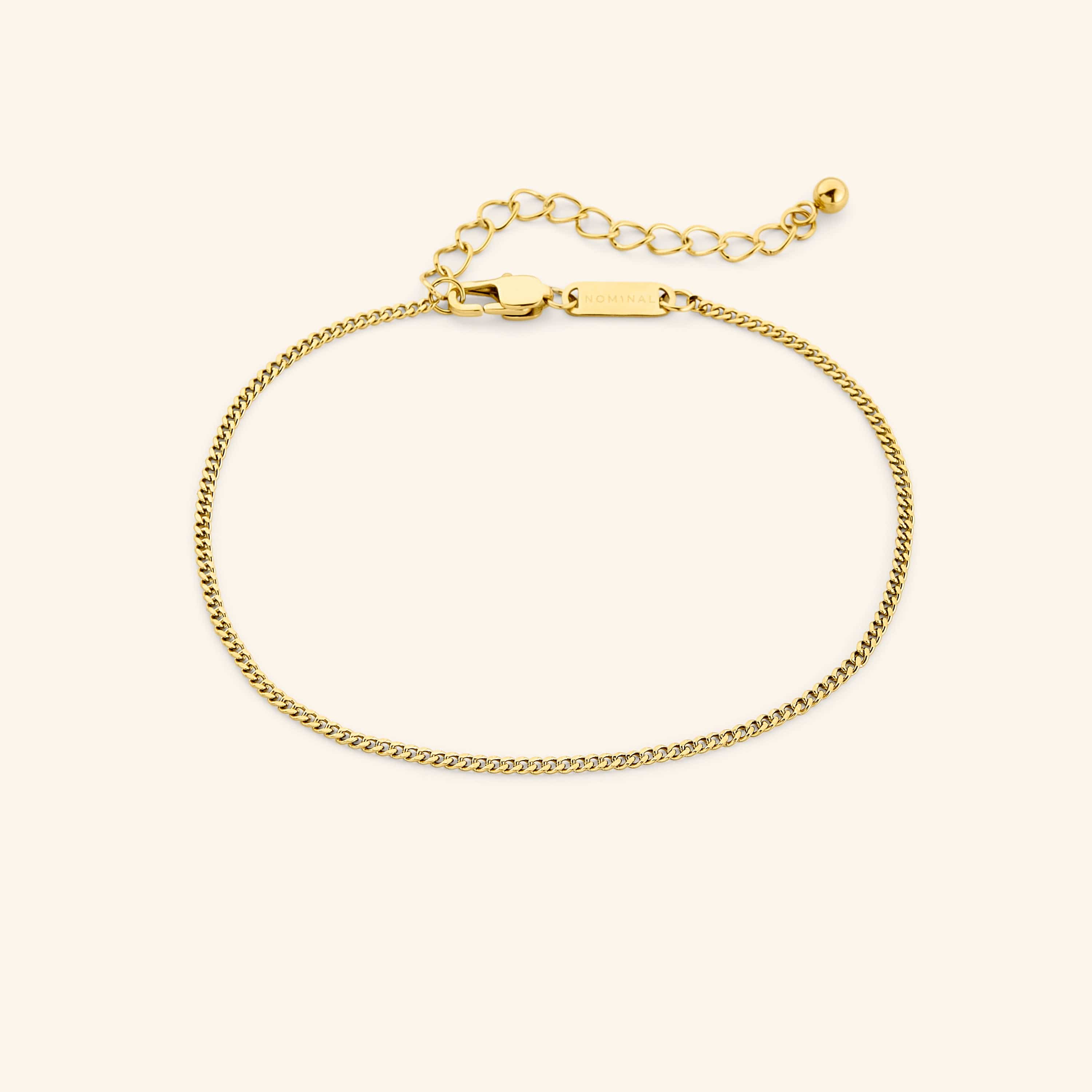 Elegant curb chain anklet showcasing flat links and gold finish.