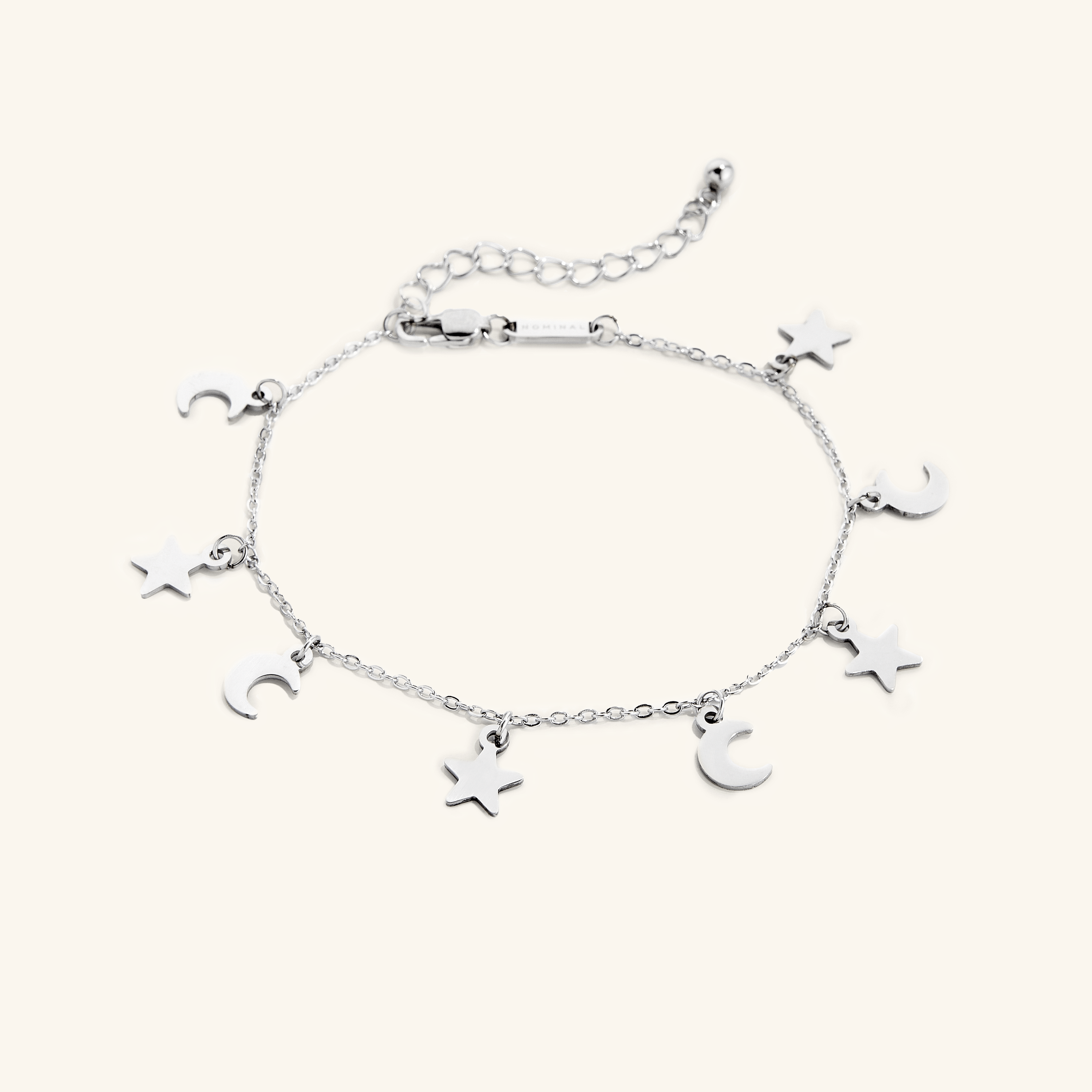 Top view of the gold anklet laid flat to highlight chain style and extension clasp