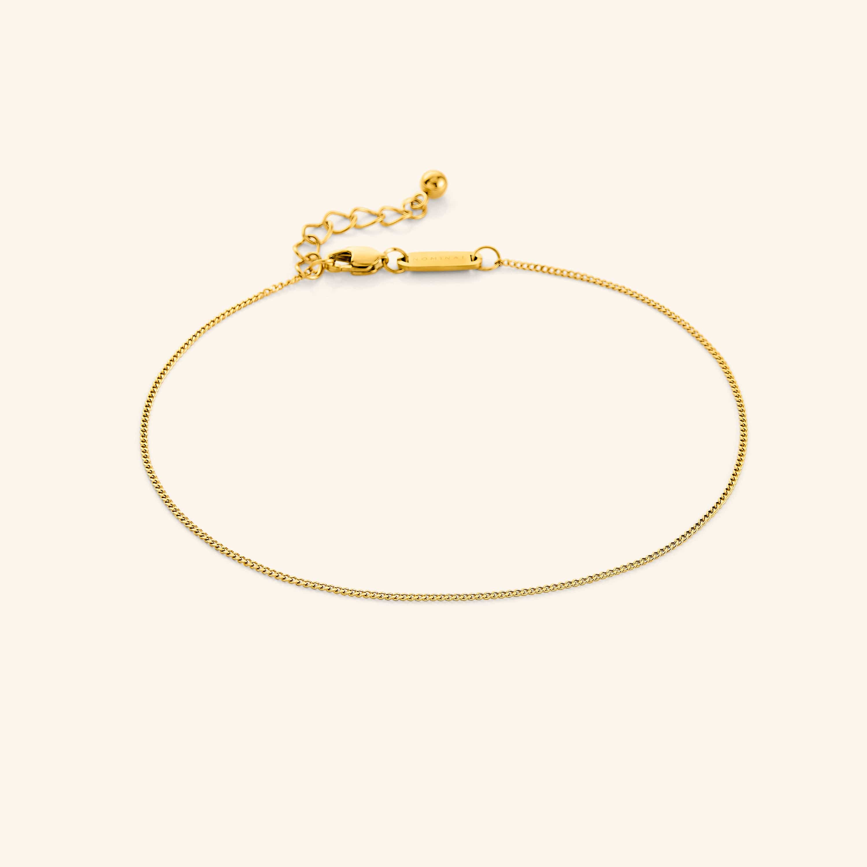 Invisible Curb Anklet on a model's ankle, showcasing its elegant design and fit.
