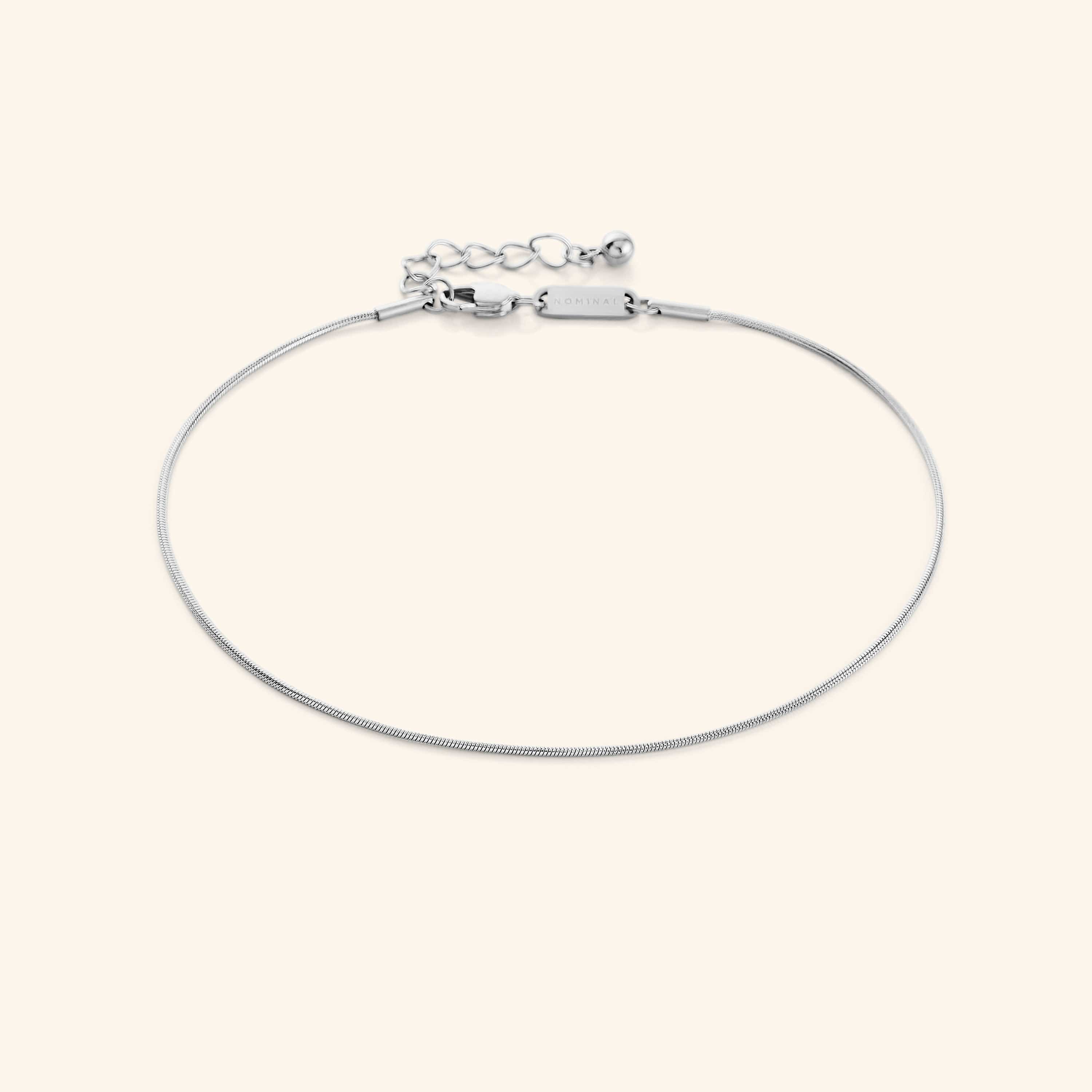 Close-up of the Elegant Harmony Gold Anklet highlighting its seamless 1MM snake-like chain.