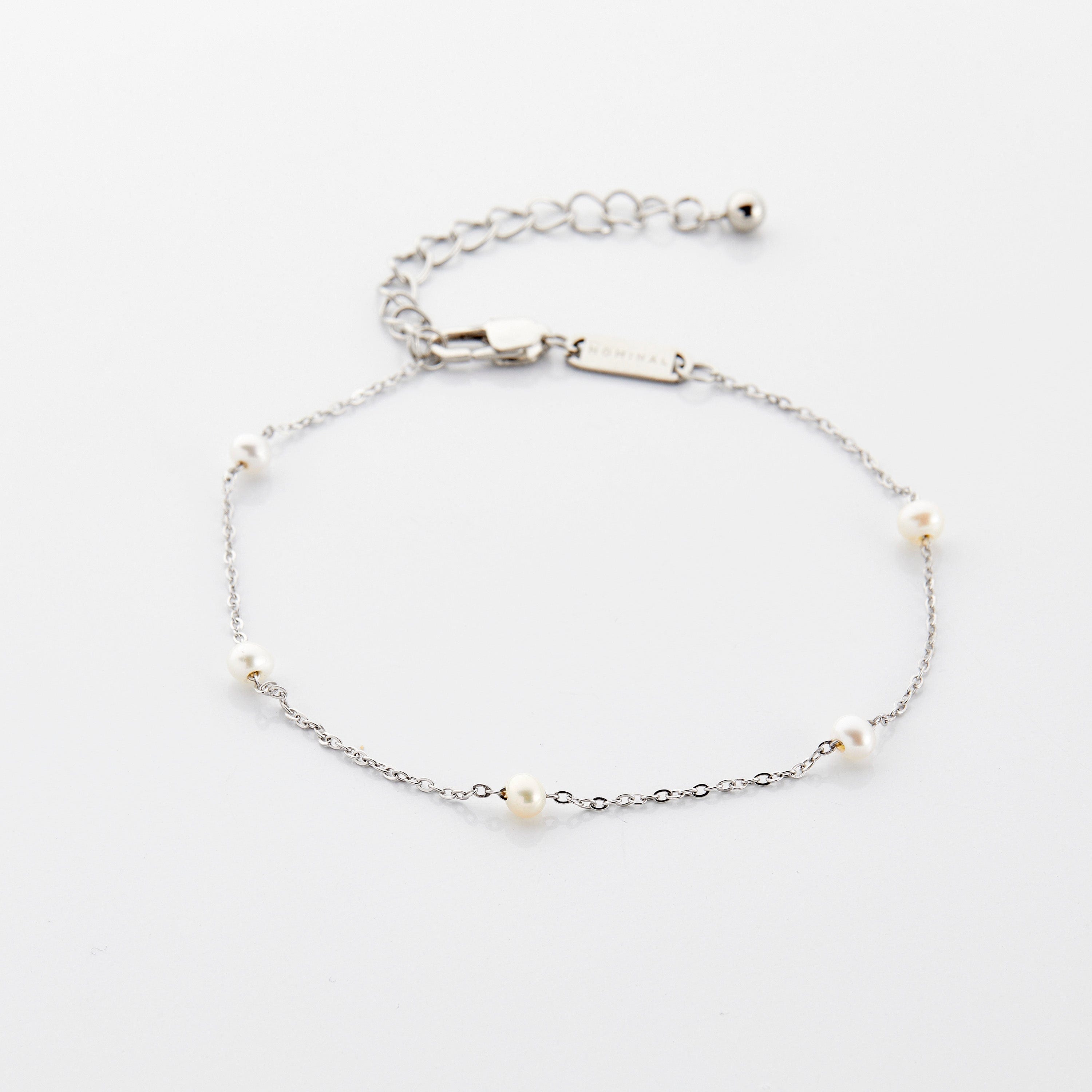 A woman wearing the waterproof gold anklet for everyday wear, highlighting its versatility.