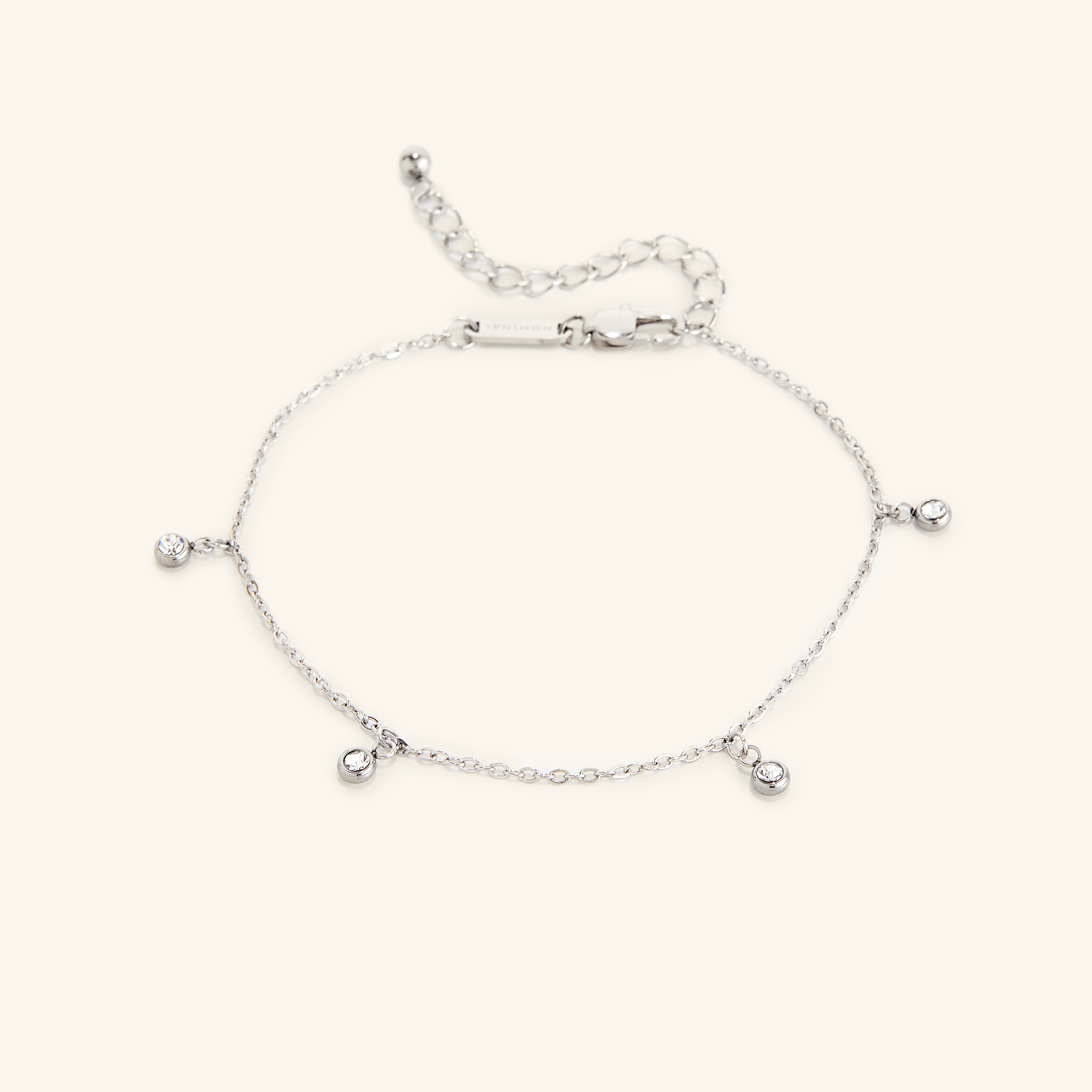 Lifestyle shot of the waterproof anklet for sensitive skin being worn at the beach.