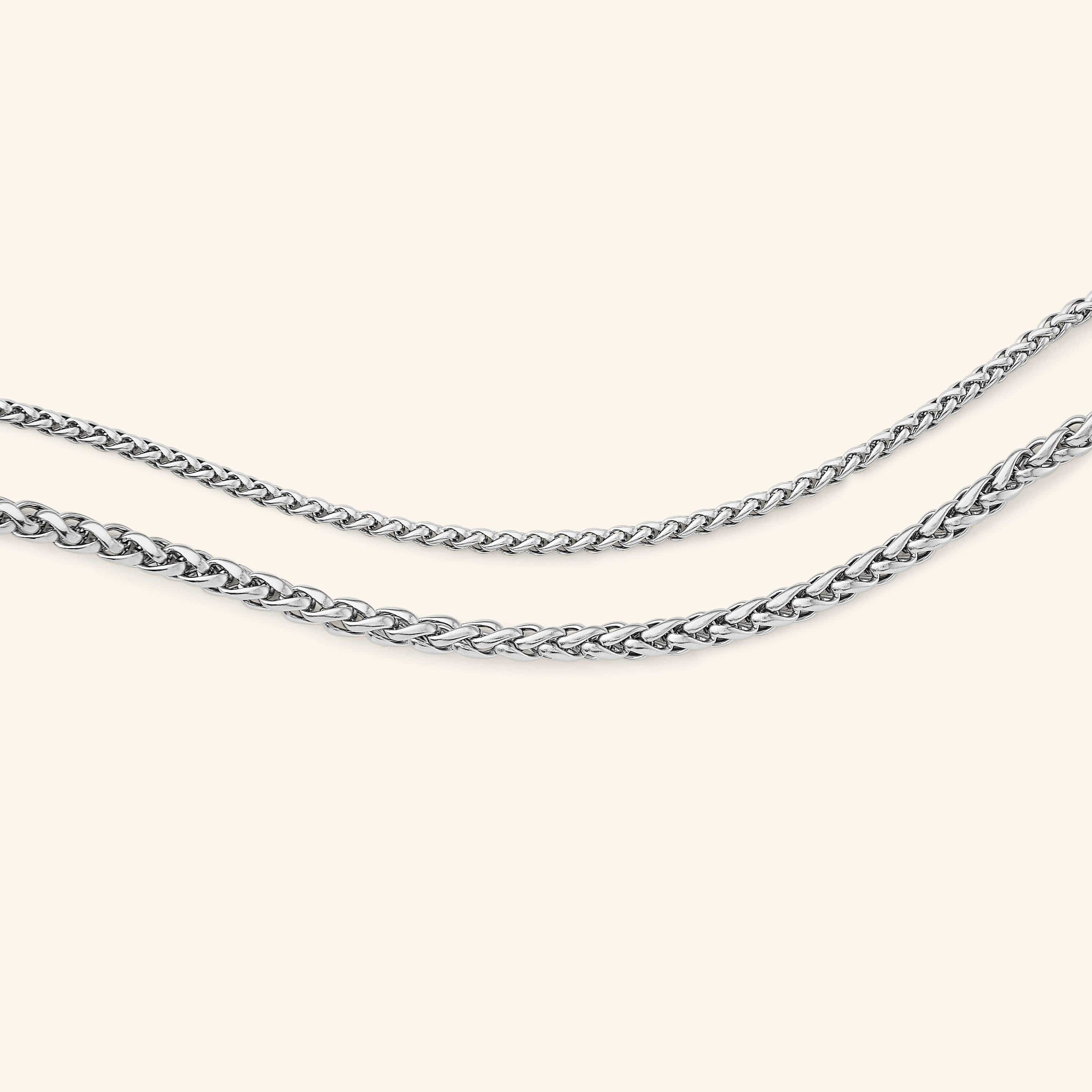 Premium gold anklet for women with extension, presented in a velvet drawstring pouch.