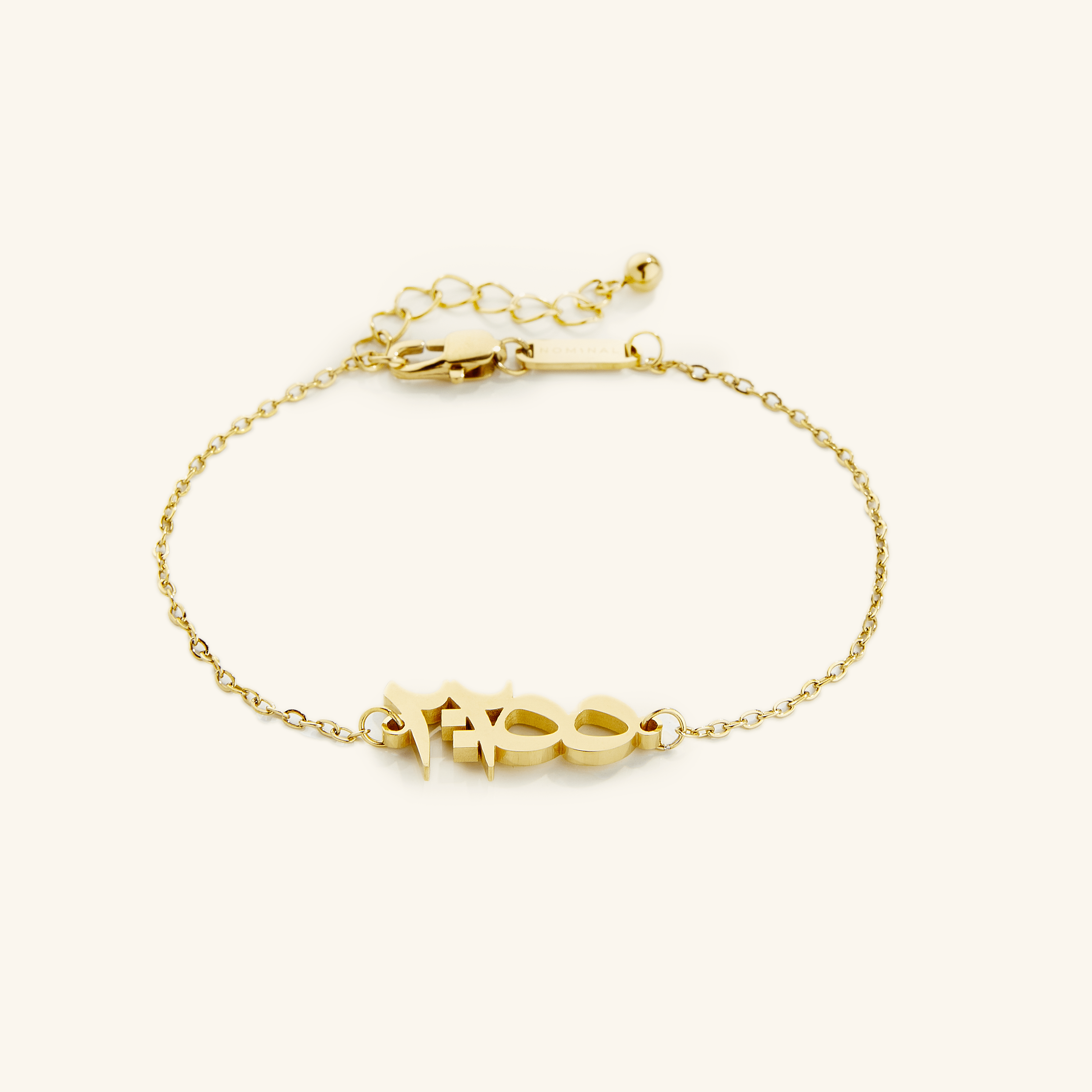 Close-up of the gold plated Ayatul Kursi bracelet highlighting the Arabic calligraphy.
