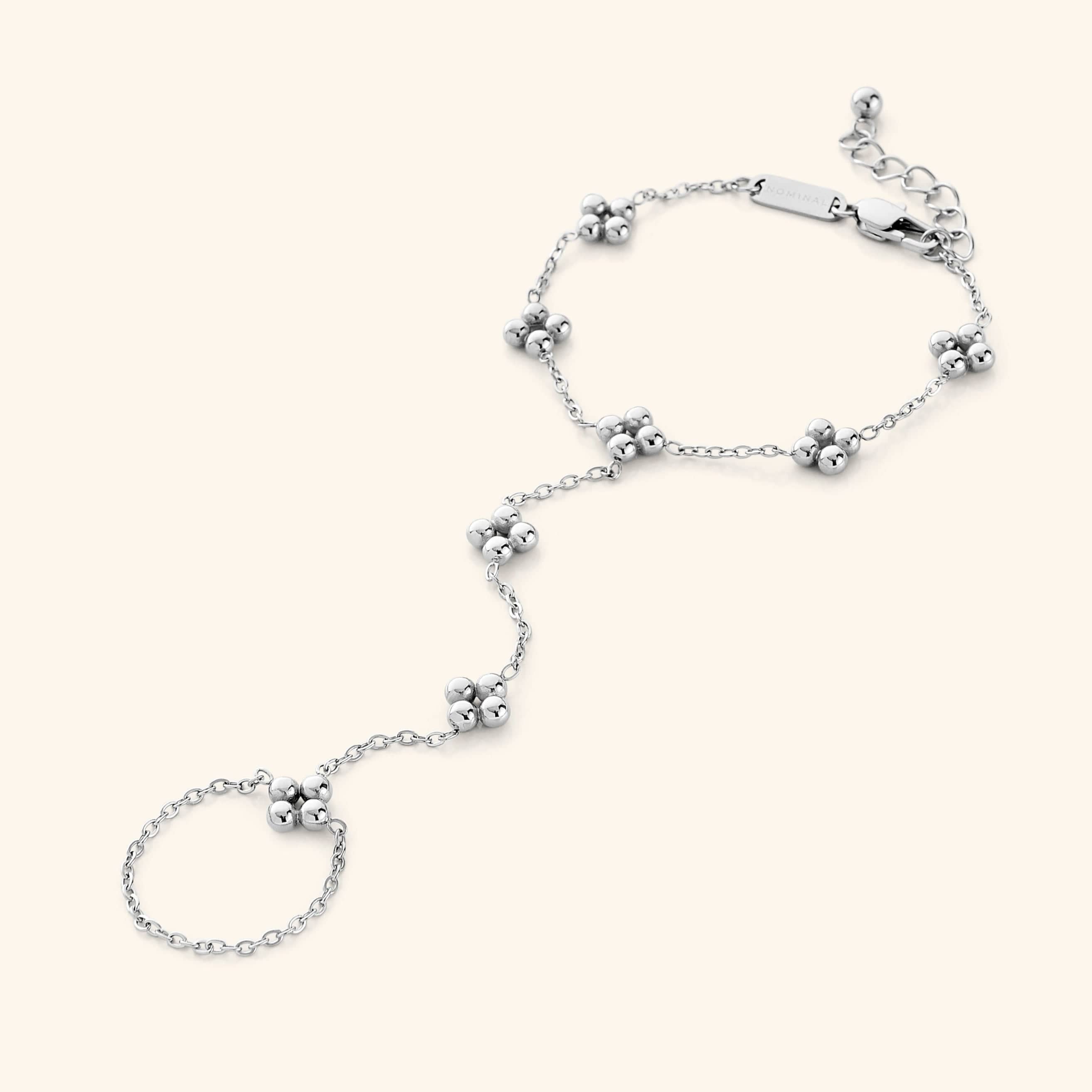 Close-up of the bohemian henna hand chain showcasing the clover cluster design.