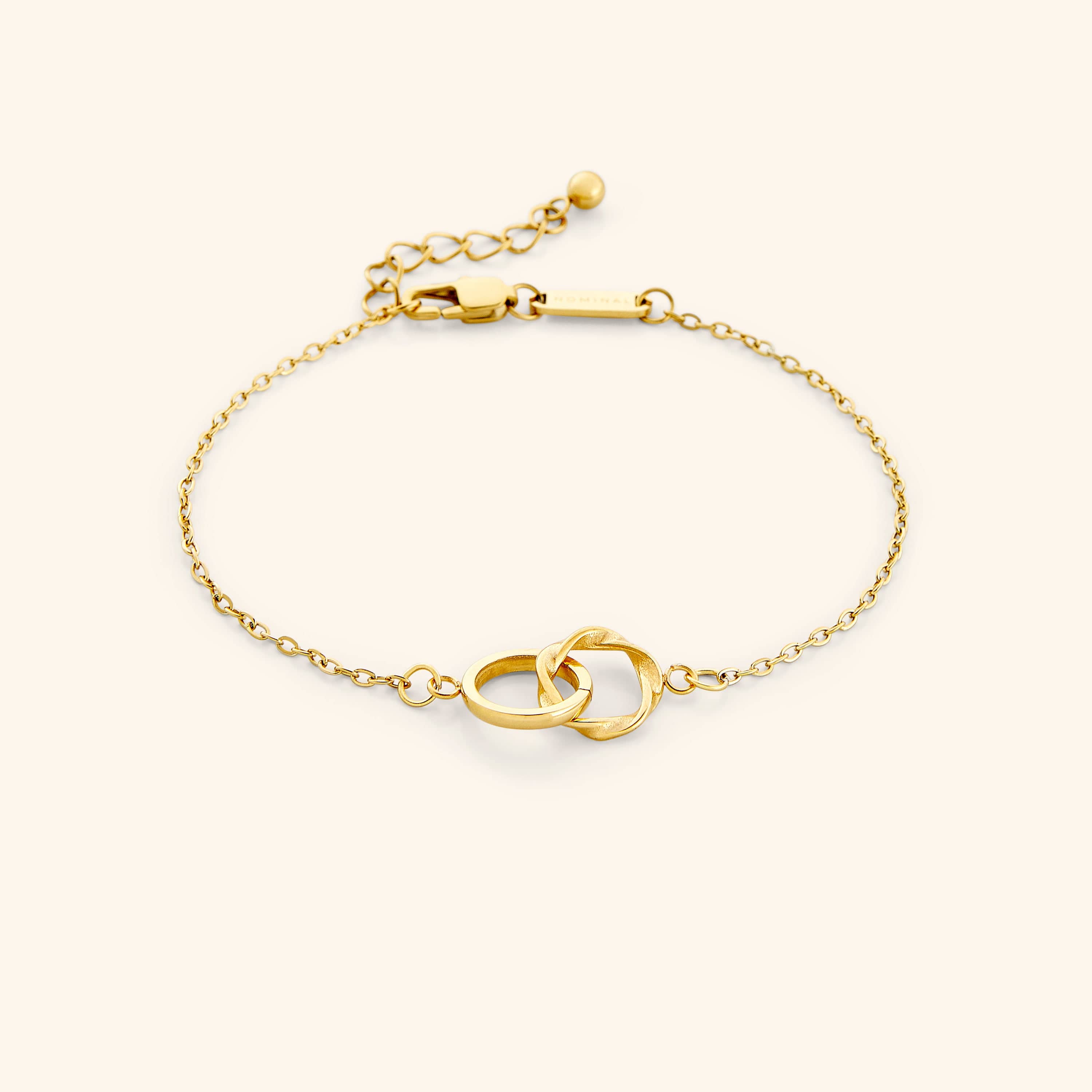 Close-up of the Elegant Sister Bond Bracelet highlighting the ripple-style ring and gold plating.