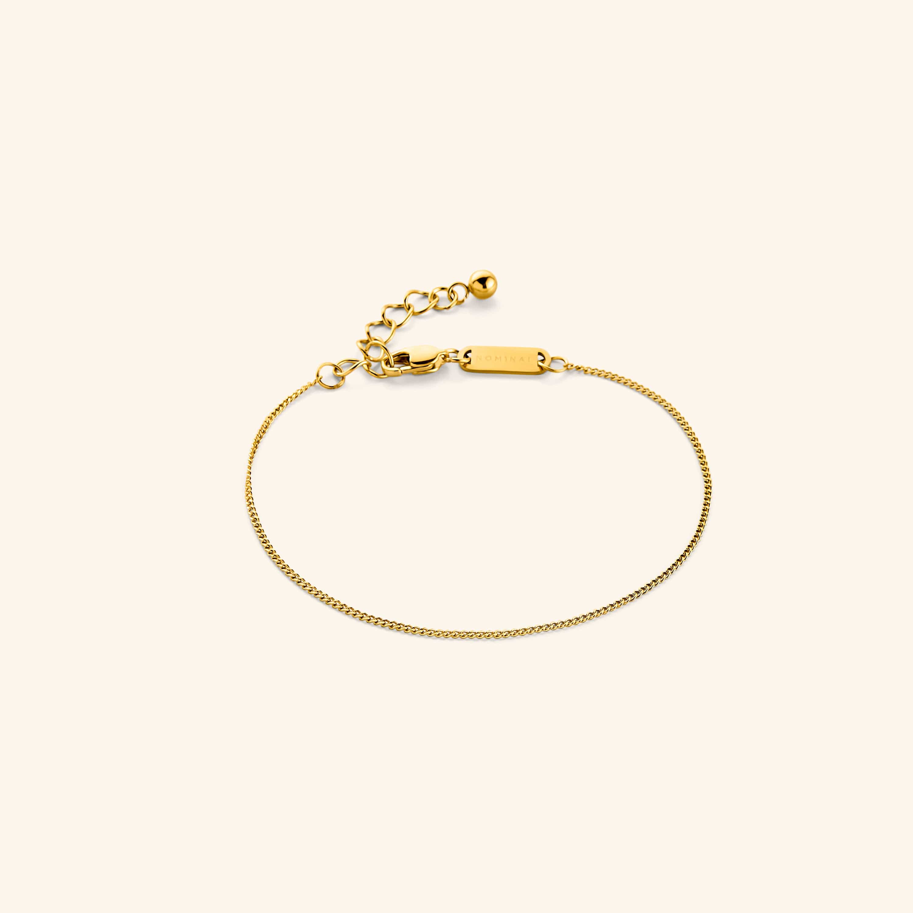 Close-up of the Invisible Curb Gold Bracelet showcasing its 1MM flat oval chain design, perfect for fashion lovers.