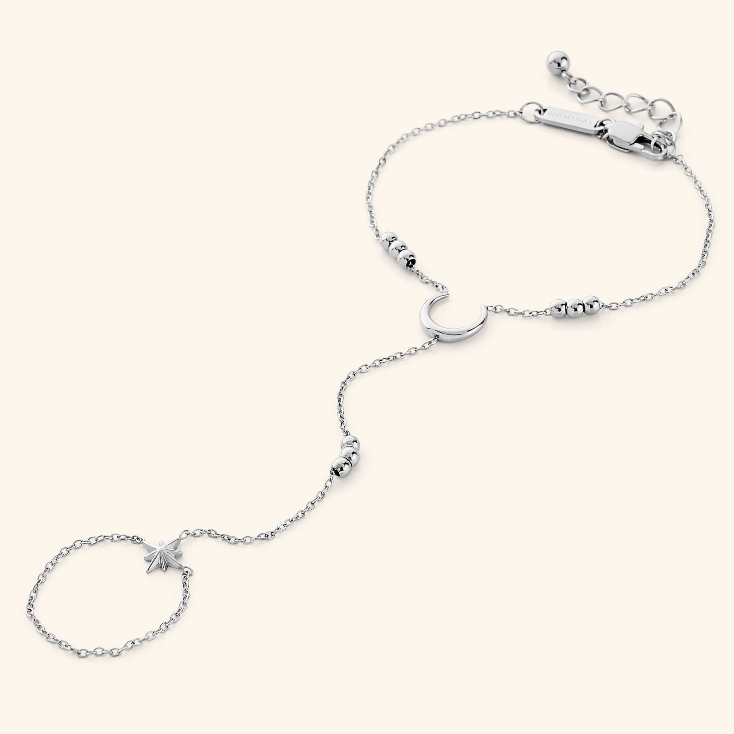 Close-up of the celestial gold hand chain highlighting the intricate orb clusters.