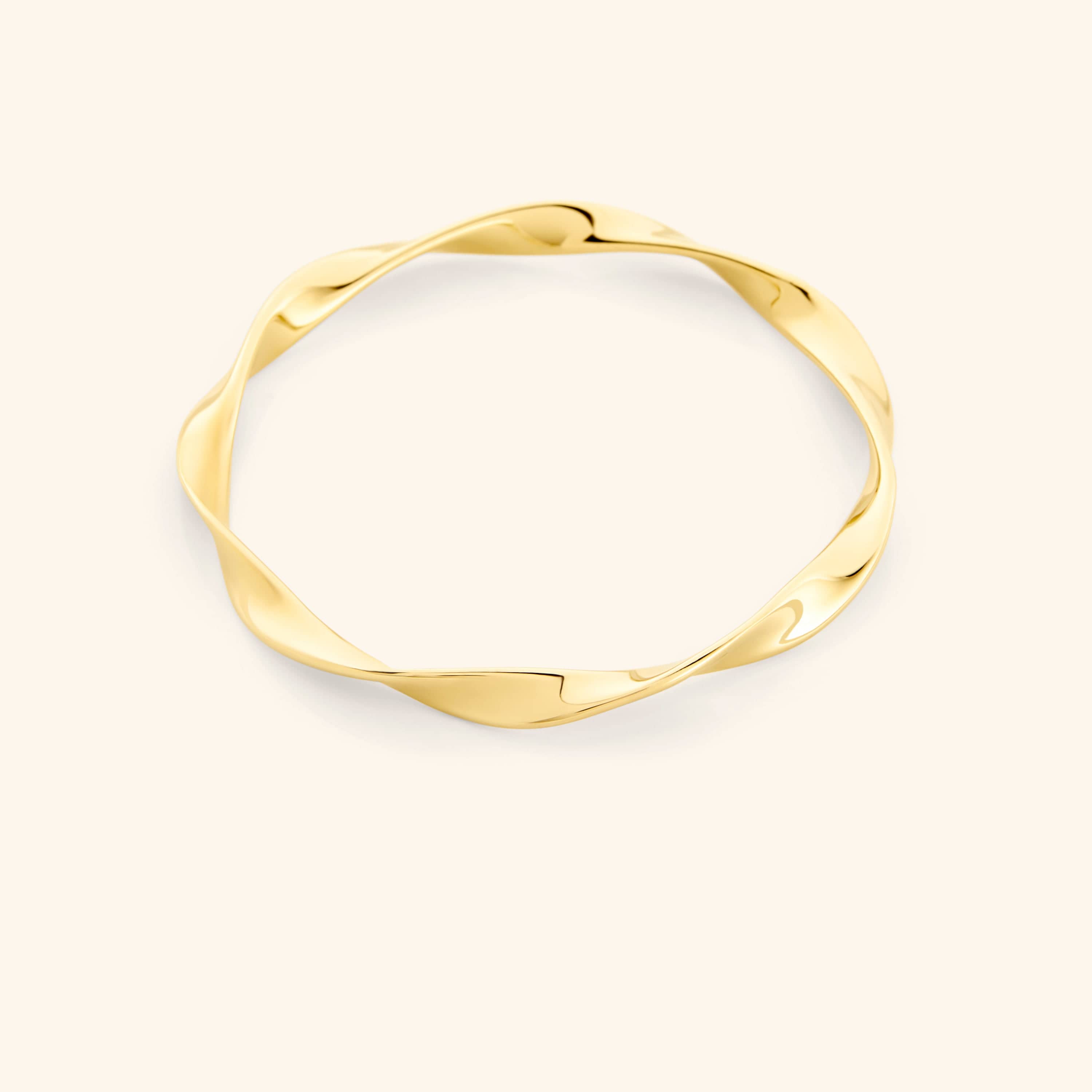 Elegant gold ripple bangle showcasing the unique design and shine.
