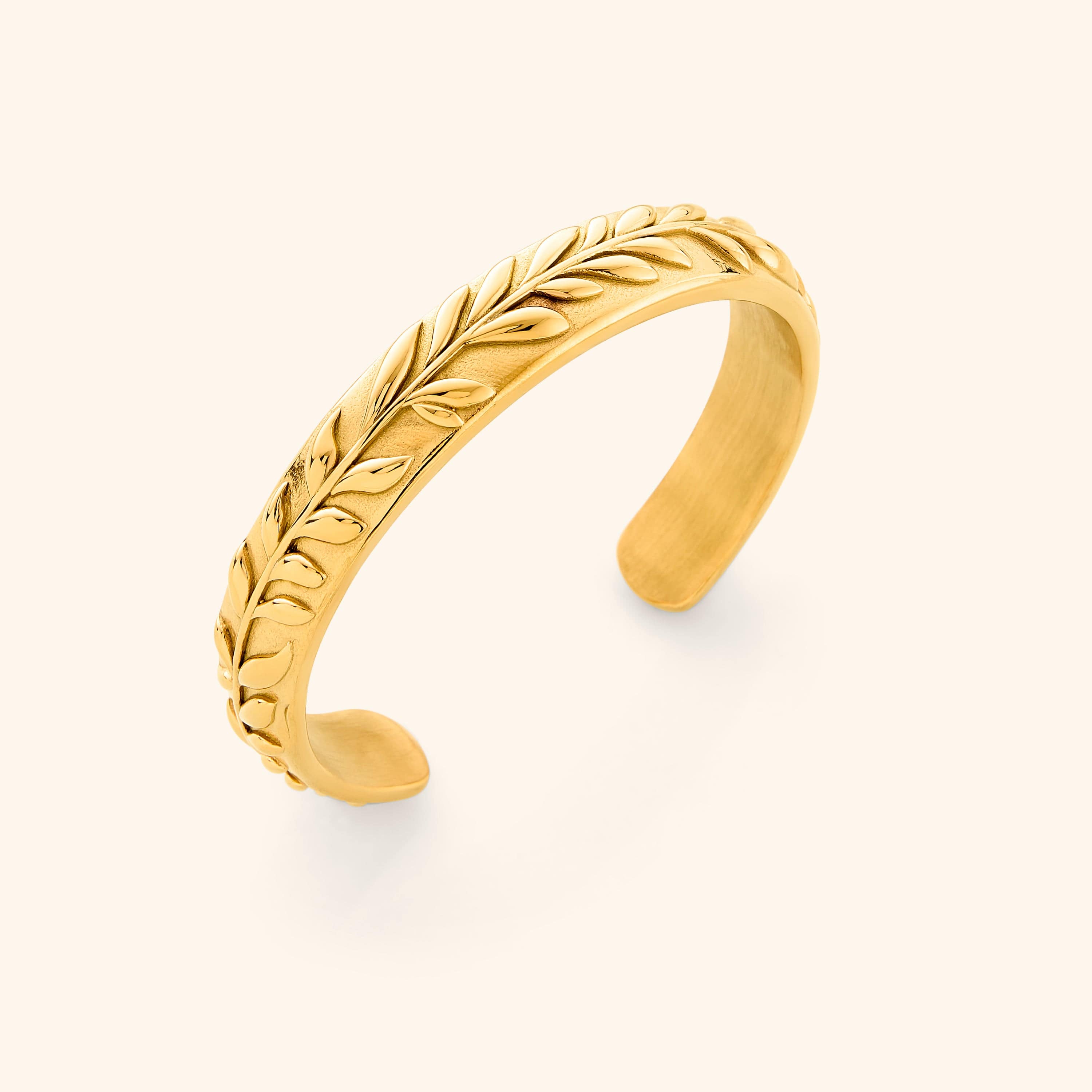 Close-up of the Olive Tree Resilience Cuff Bracelet highlighting its embossed design and gold finish.