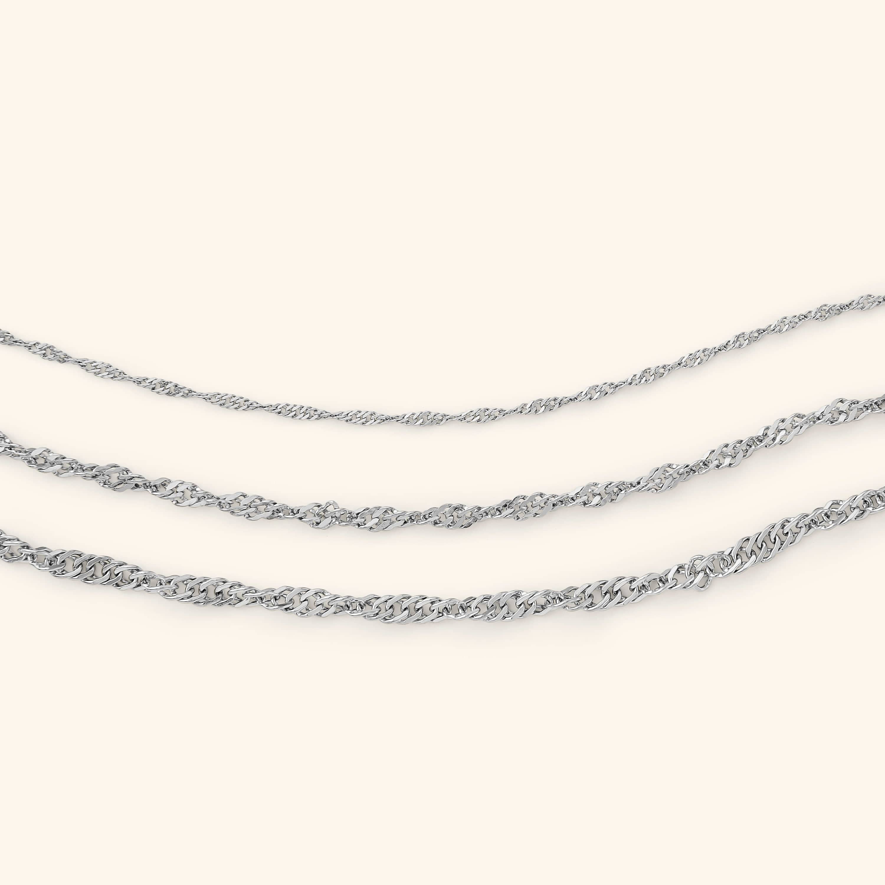 Close-up of RadianceTwist™ chain bracelet showing twisted link detail under natural light.