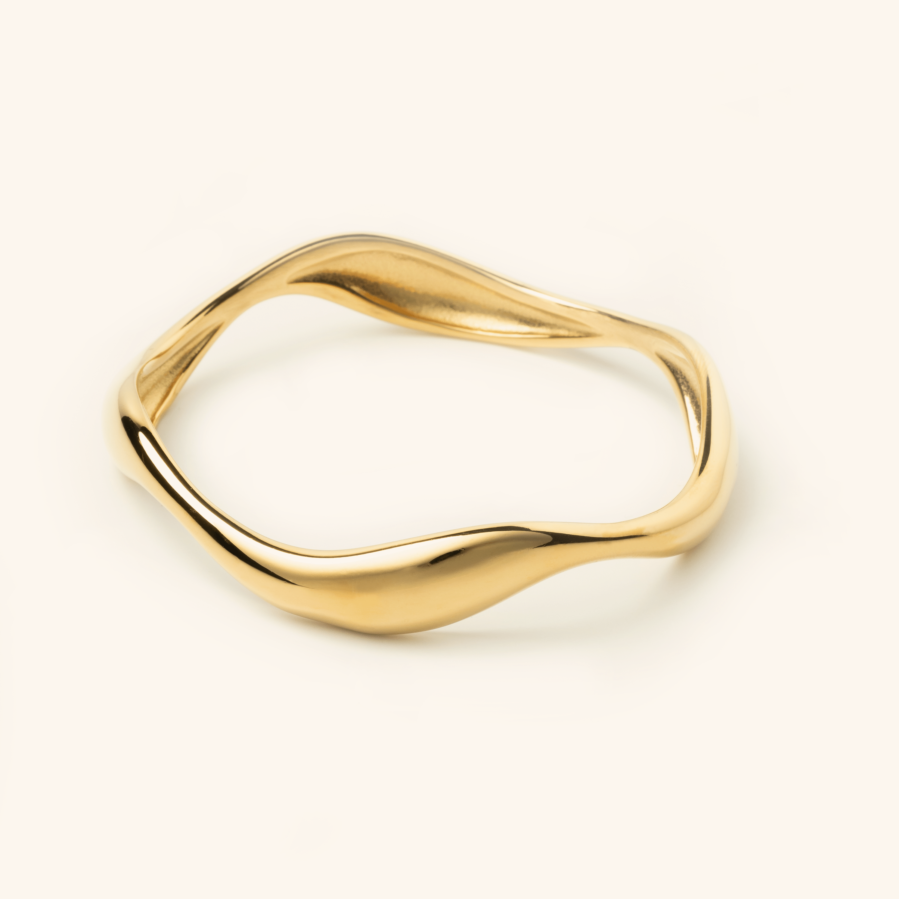 Ocean Wave Bangle showcasing its elegant curves from the side.