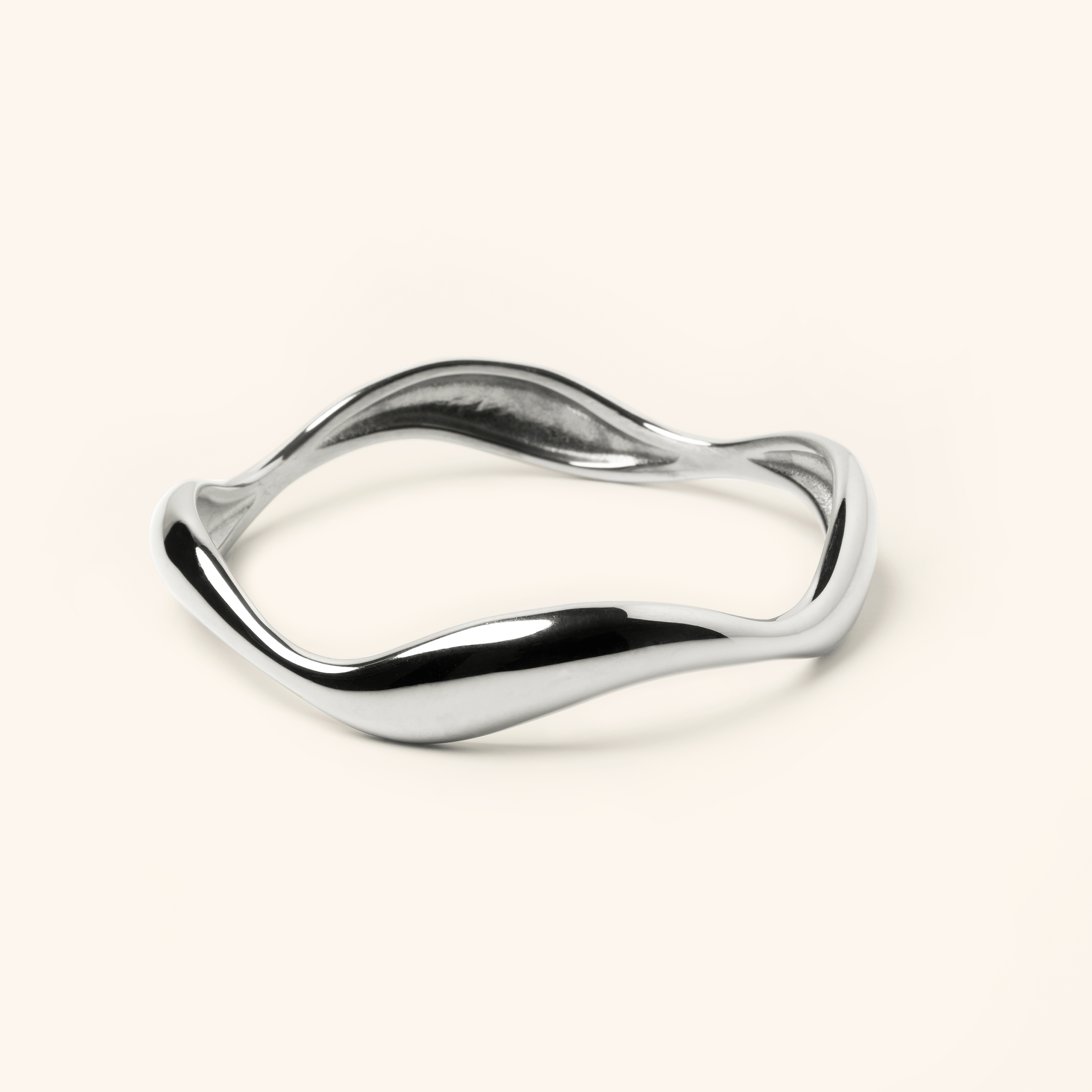 Ocean Wave Bangle showcasing its elegant curves from the side.