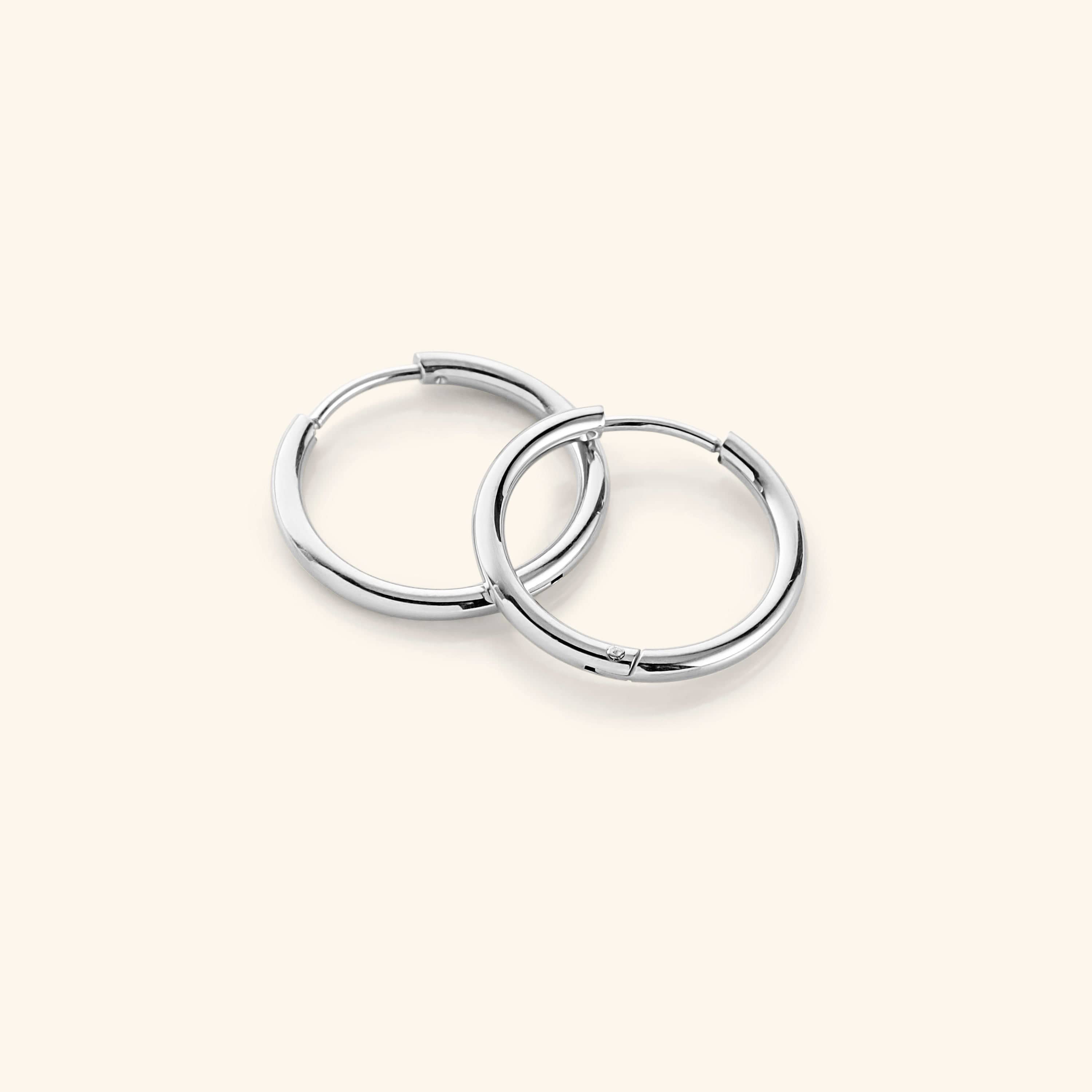 Close-up of the 16mm medium hoops worn, demonstrating their versatility with casual attire.