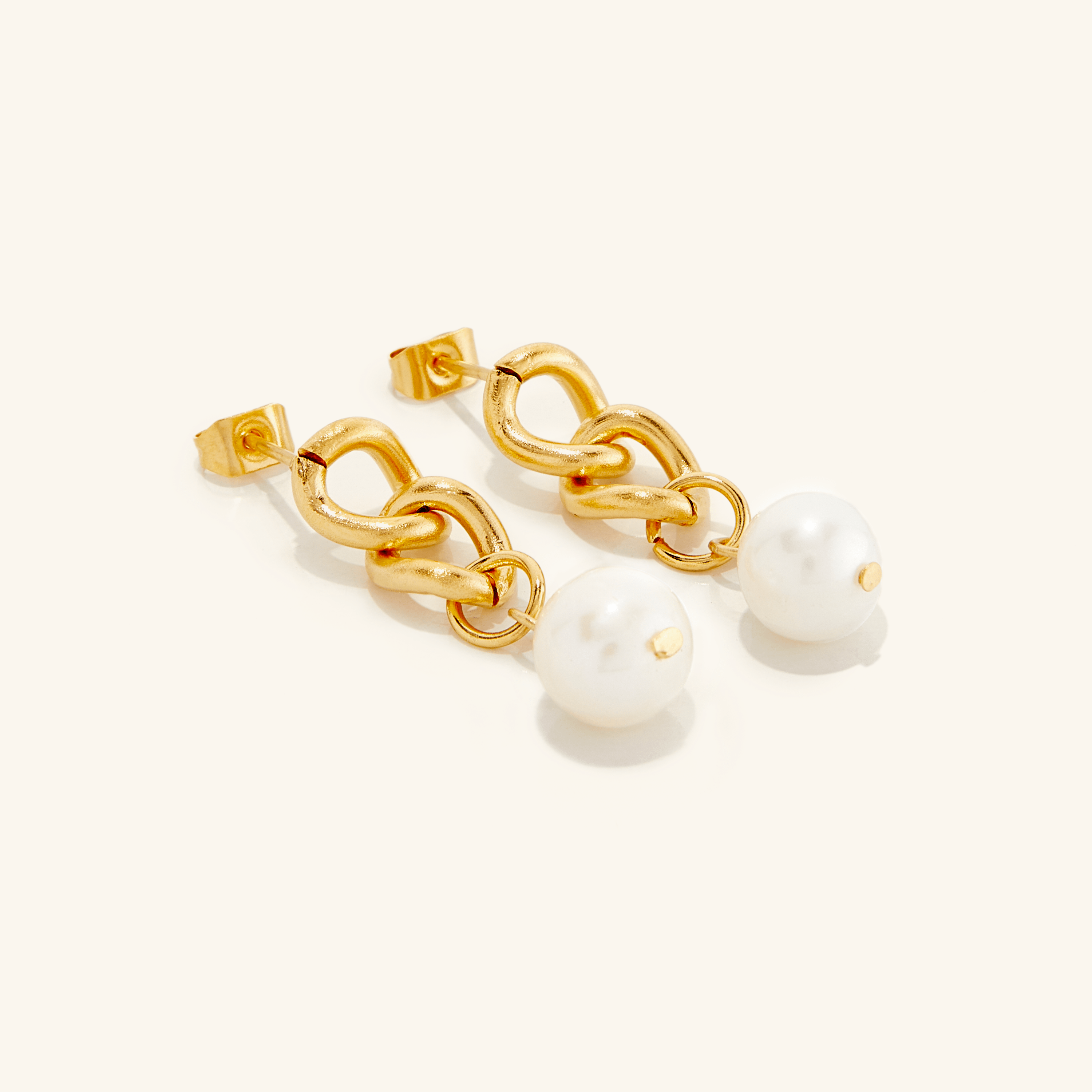 Elegant Hanging Pearl Earrings from a side angle showcasing the gold-plated finish and round pearls.