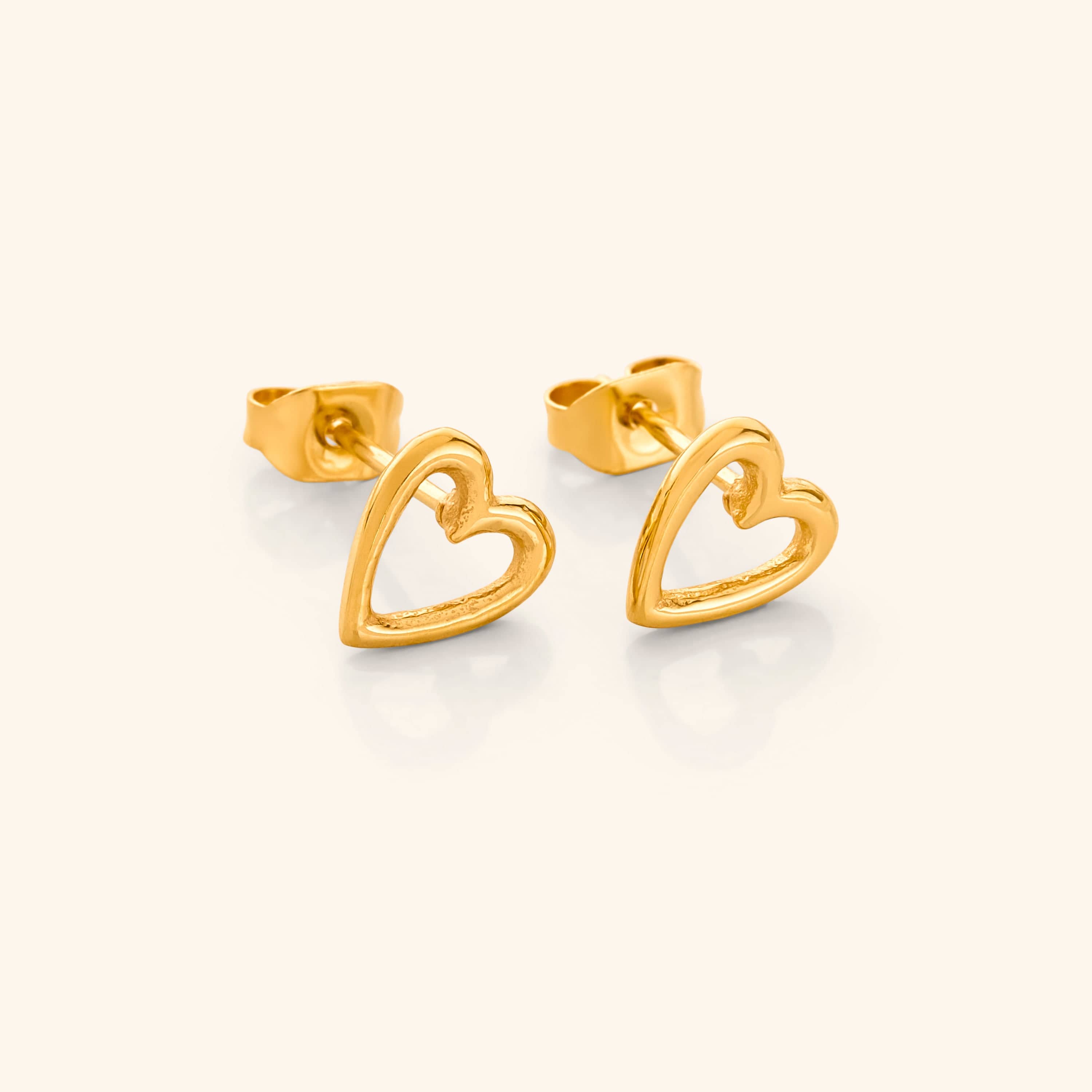 Minimalist hollow heart earrings, perfect for everyday wear. Subtle design ideal for casual or formal looks.