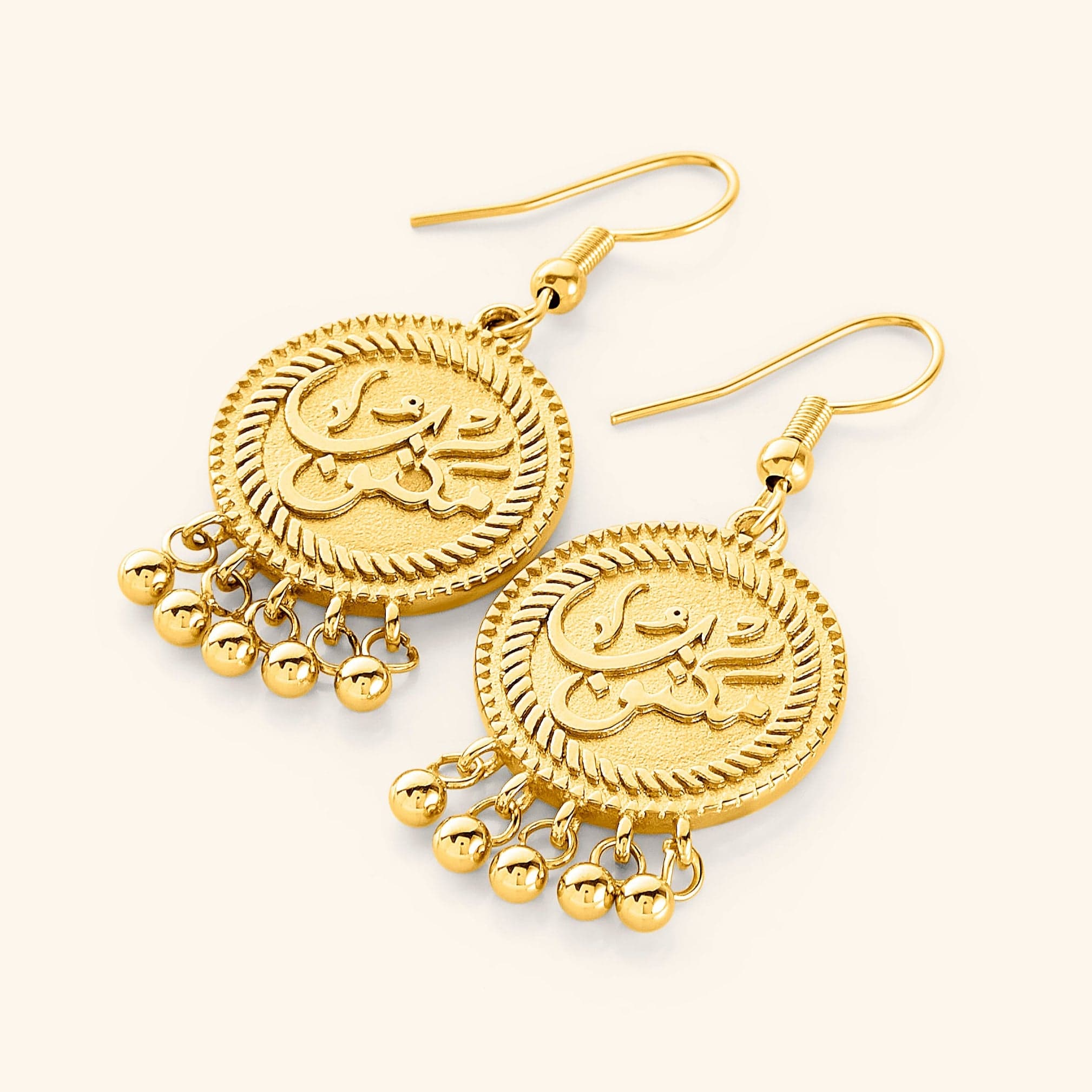 Elegant vintage coin earrings featuring delicate dangling orbs, perfect for sensitive skin.