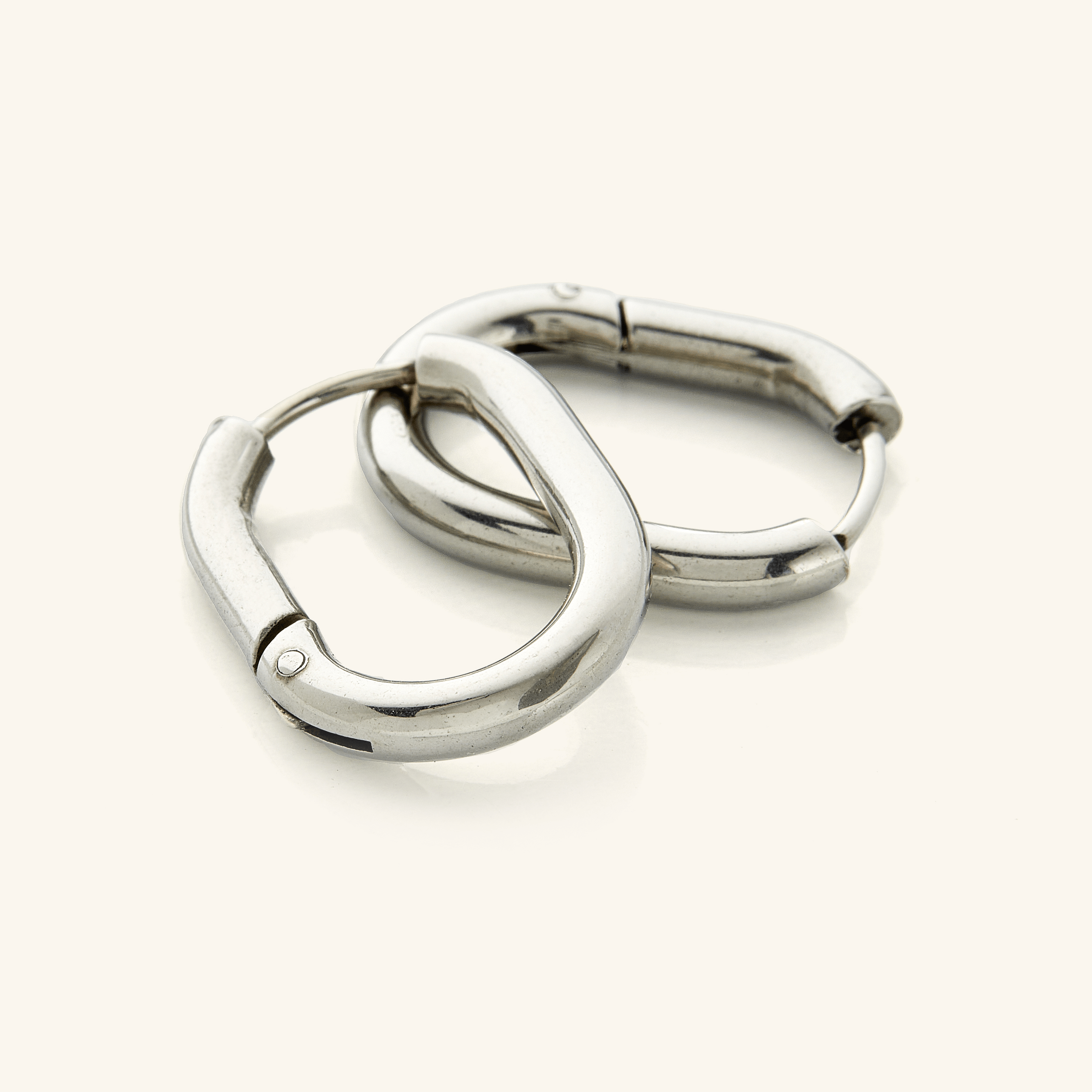 Model wearing Essential Gold Oval Hoop Earrings with a casual outfit.