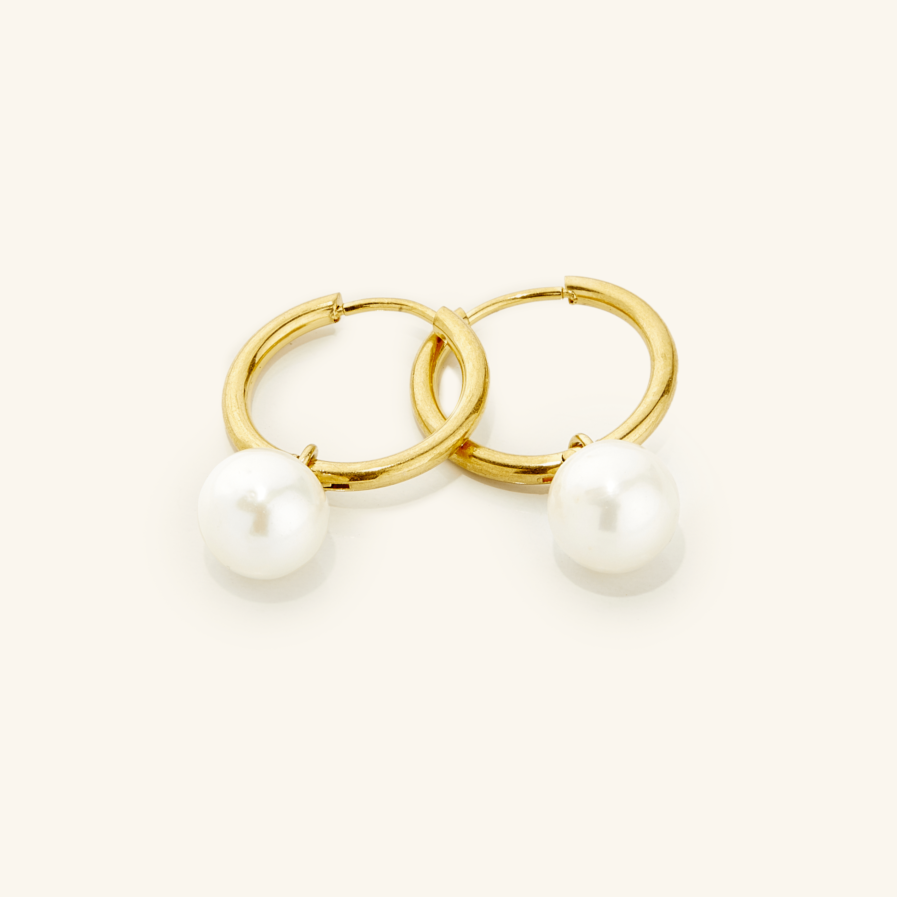 Elegant Pearl Hoop Earrings showcasing real freshwater pearls from a side angle.