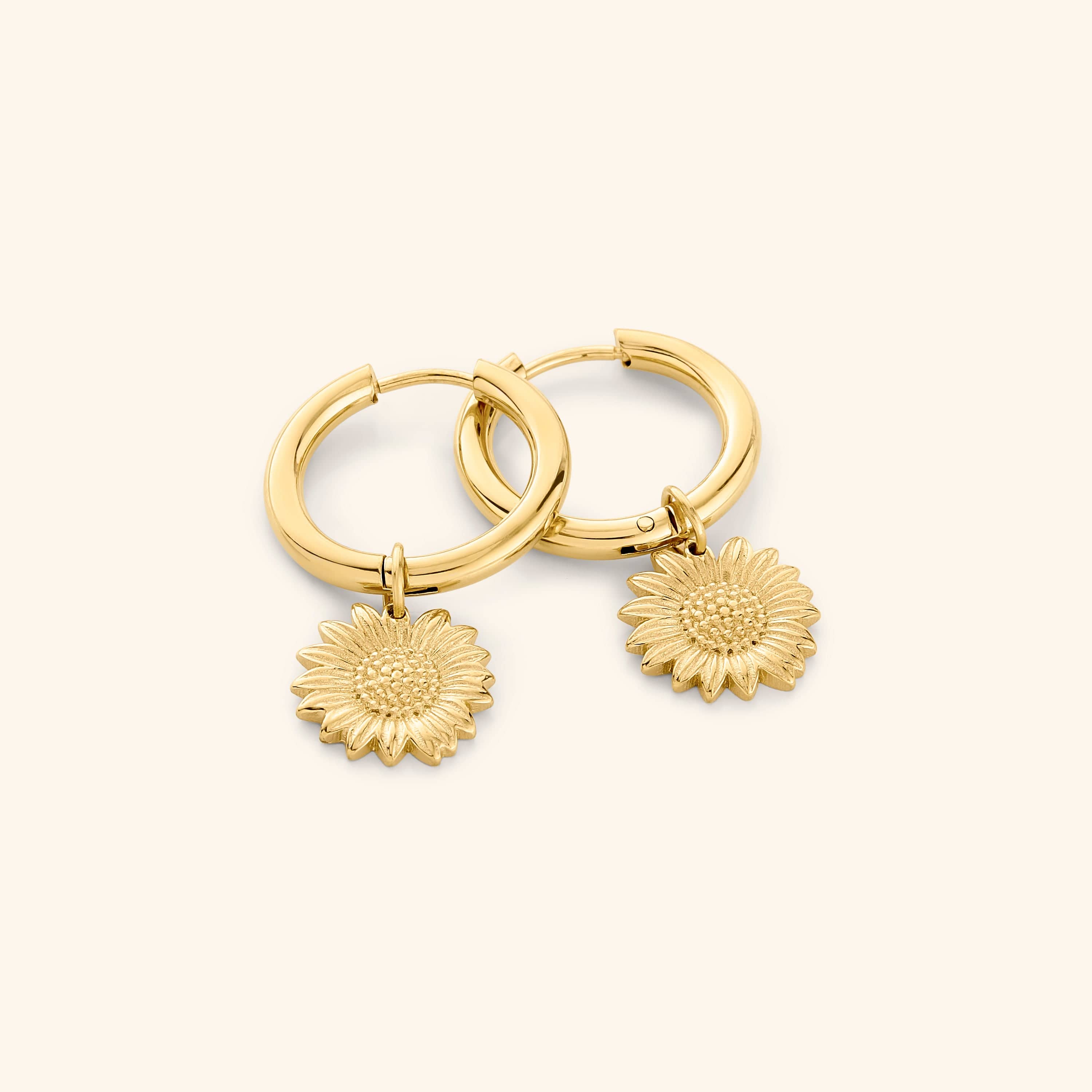 Radiant sunflower mini-hoop earrings close-up, showcasing the gold finish.