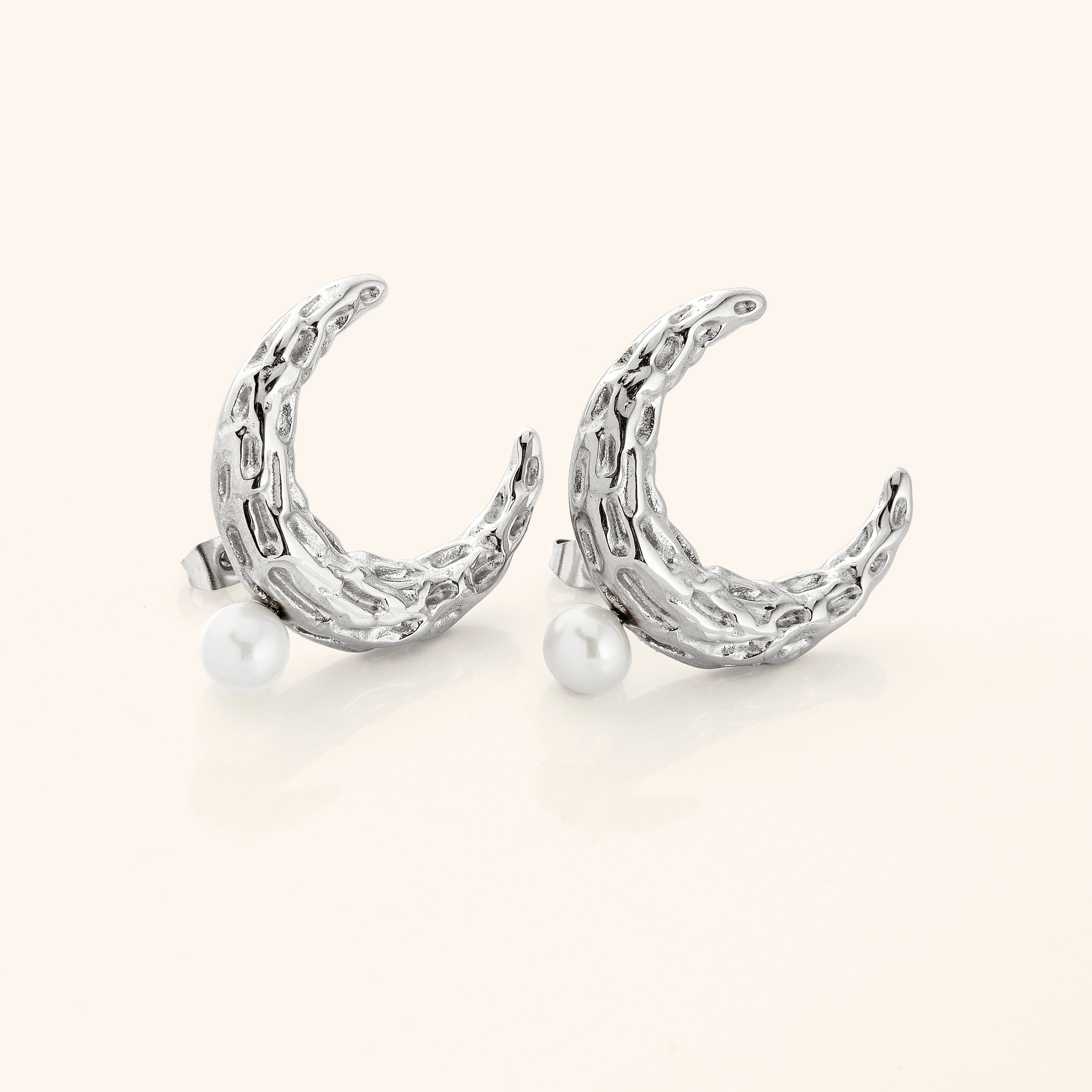 Model wearing Cascading Pearl Crescent Earrings, demonstrating their versatility from casual to formal attire.