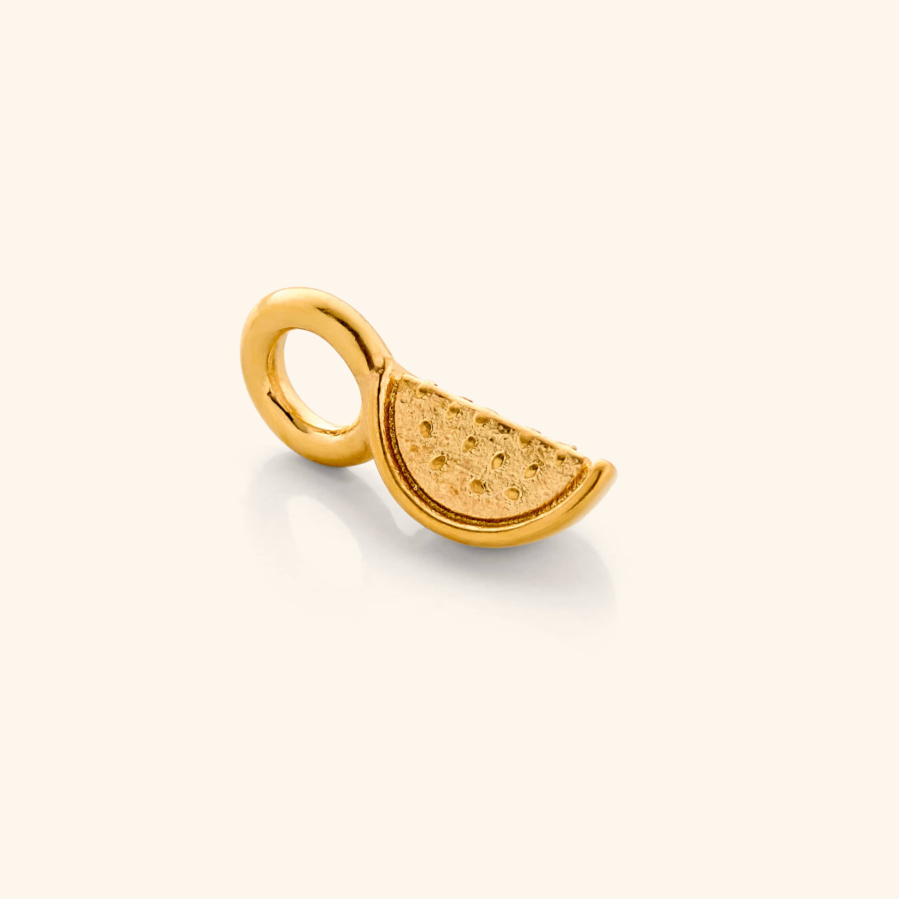 Close-up view of vibrant watermelon hoop charms highlighting their intricate design and gold plating.