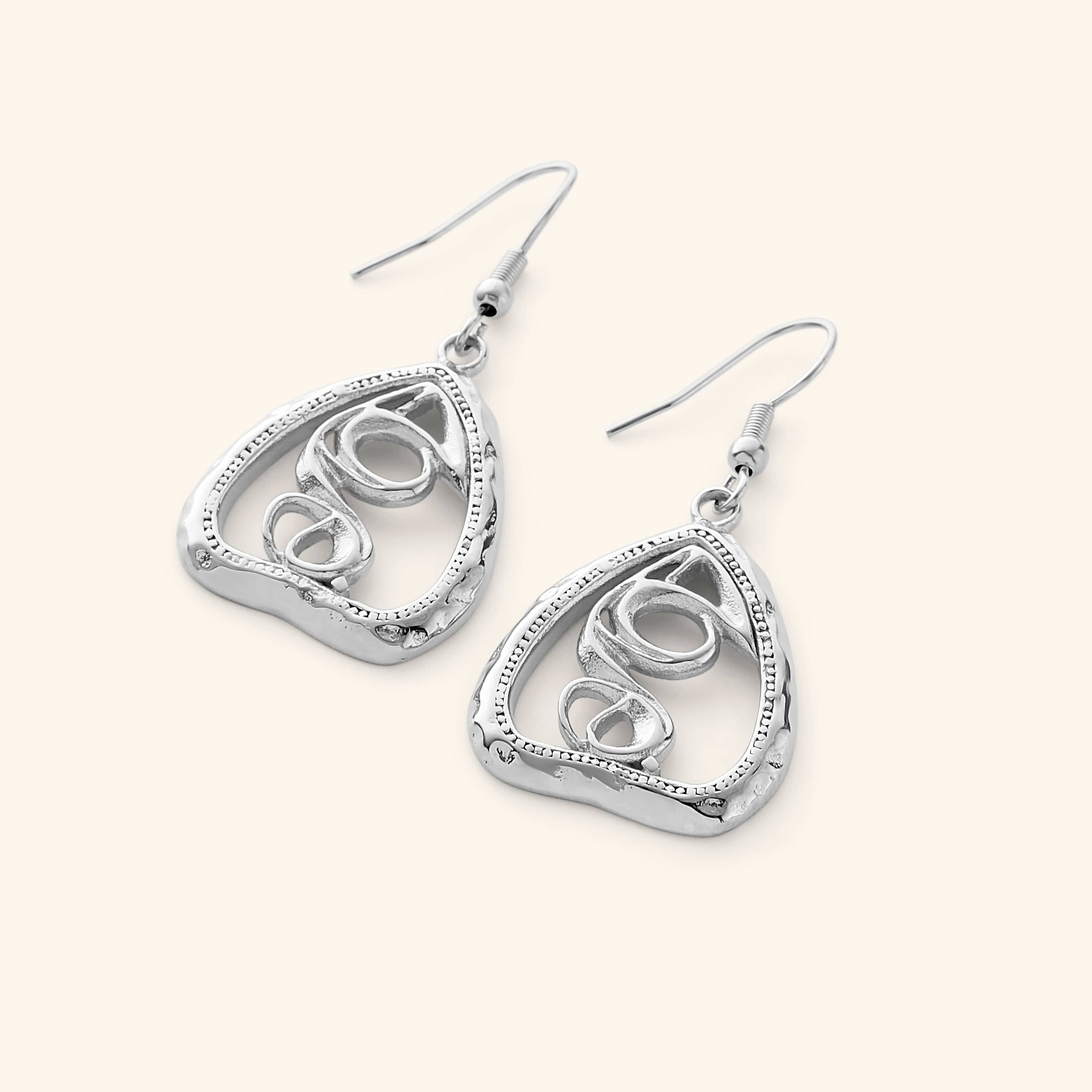 Close-up view of the Heartfelt Arabic Calligraphy Earrings showcasing the intricate design and gold plating.