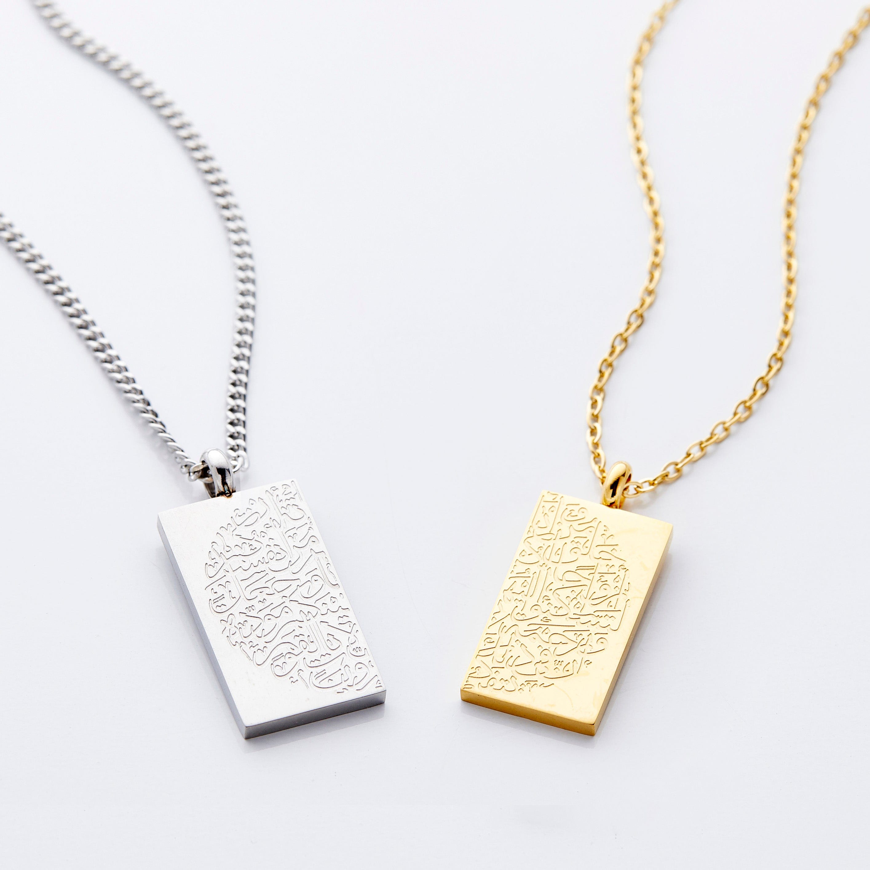 Men's silver necklace at 23 inches worn by model, showcasing the intricate engraving.