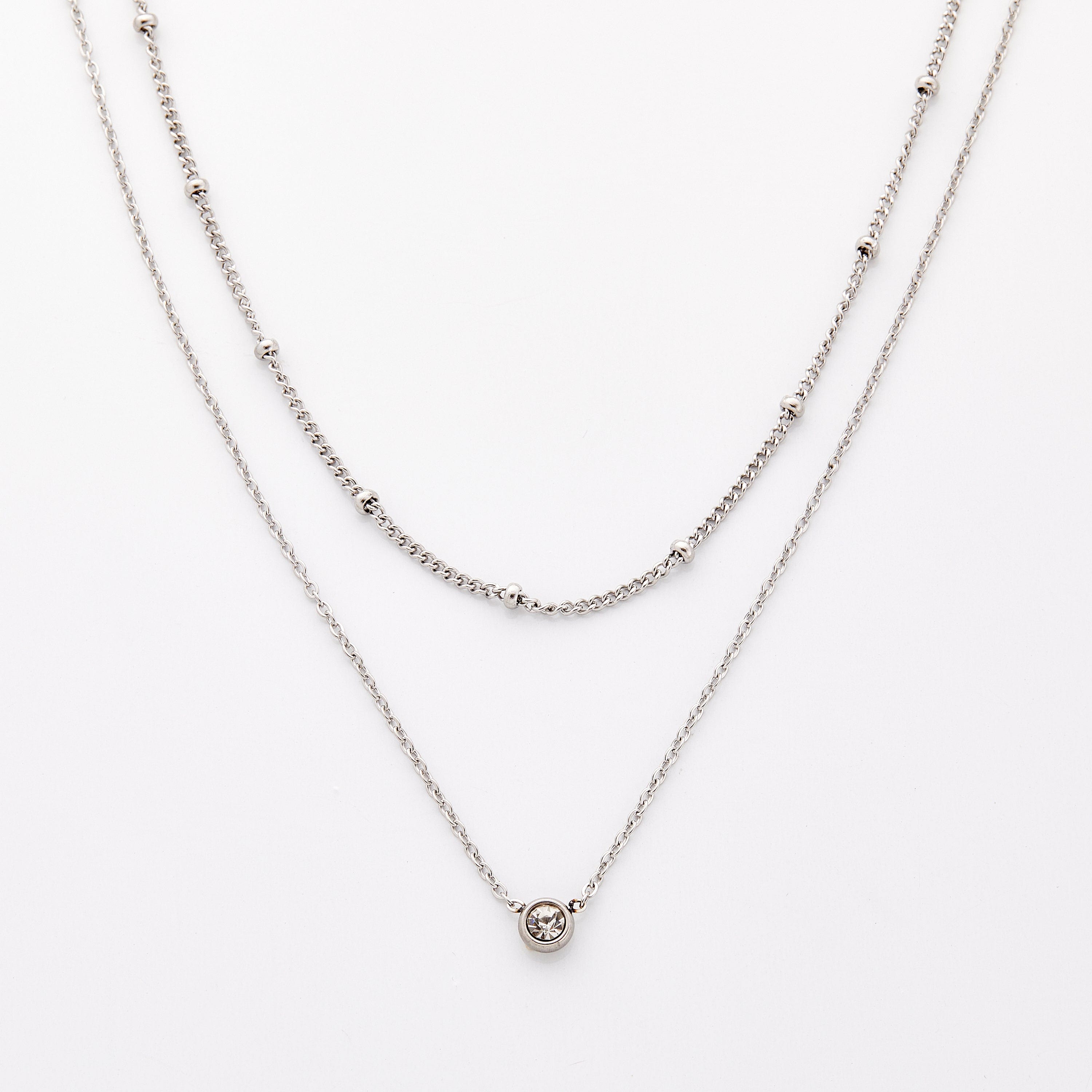Elegant Dotted & Bezel Layering Necklace Set worn at 22 inches showcasing its adjustable features.