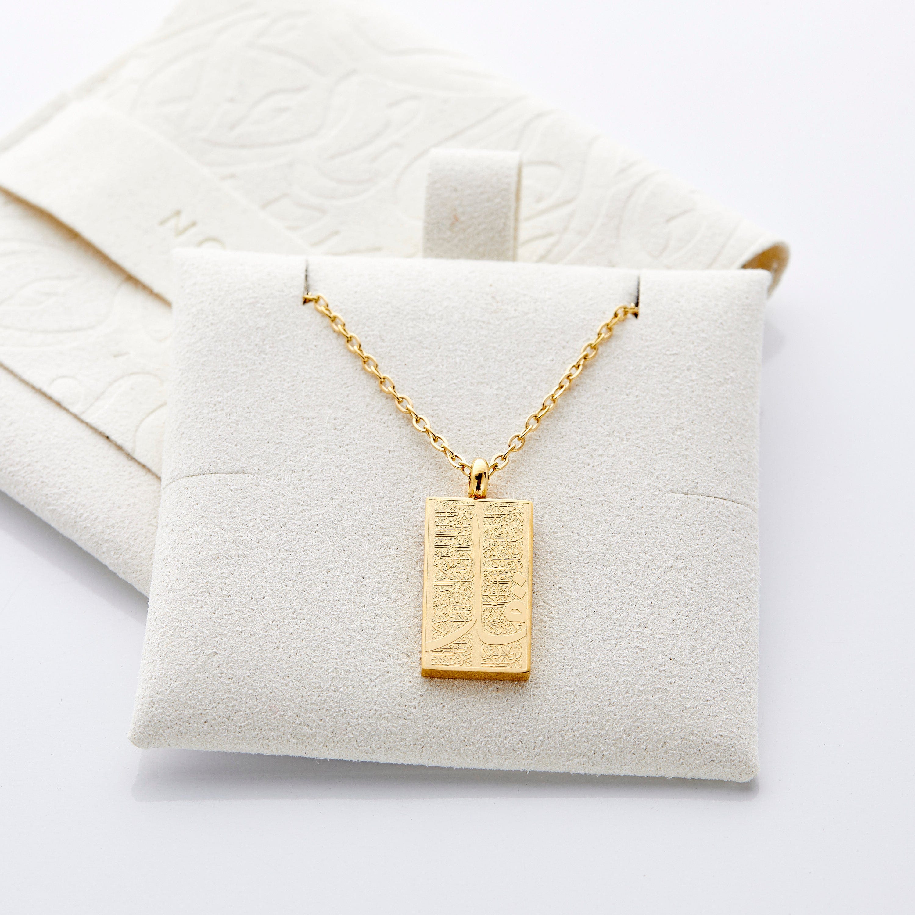 Stylish packaging of the 4 Qul necklace in a velvet pouch, perfect for gifting