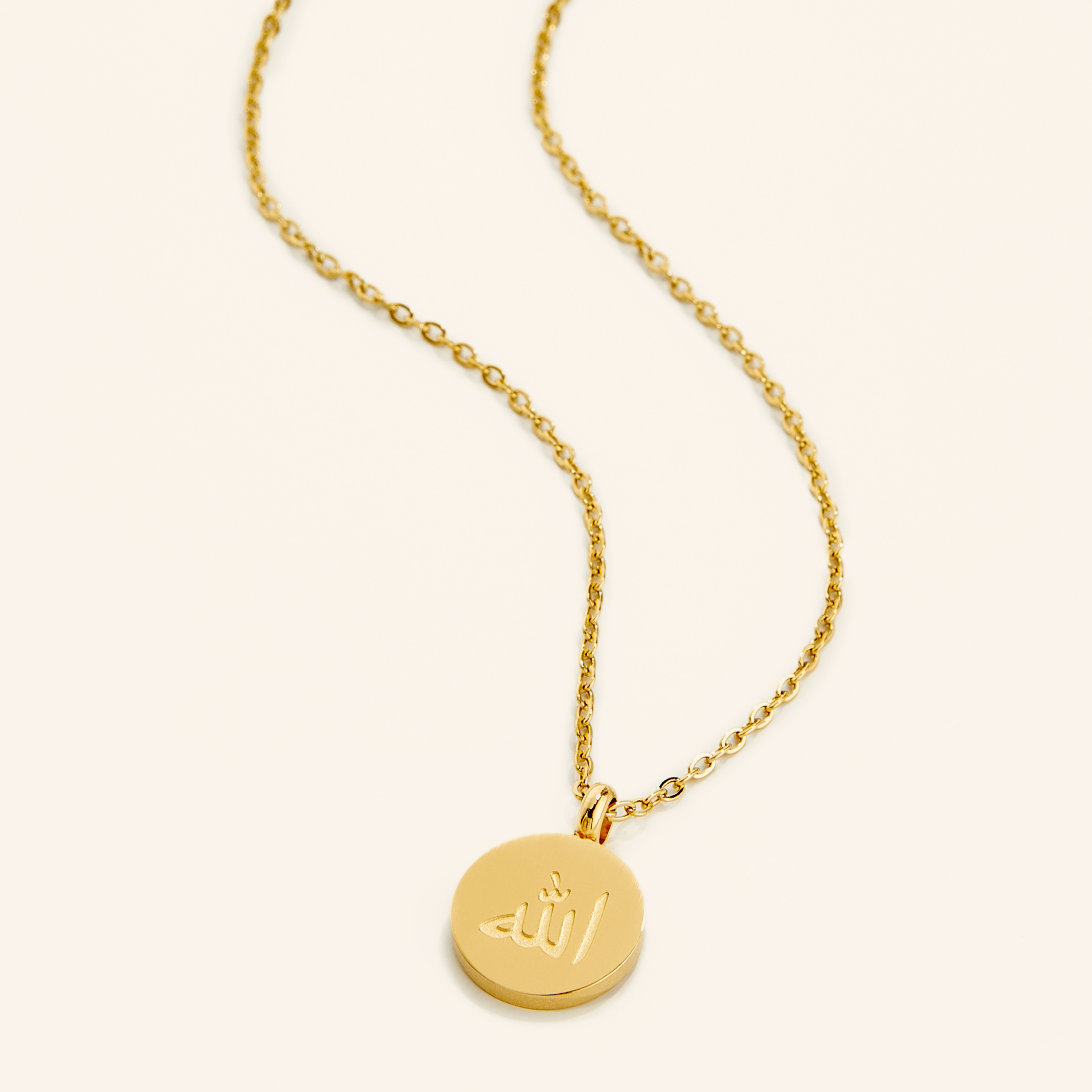 Radiant Allah necklace on a velvet pouch, highlighting its intricate design.