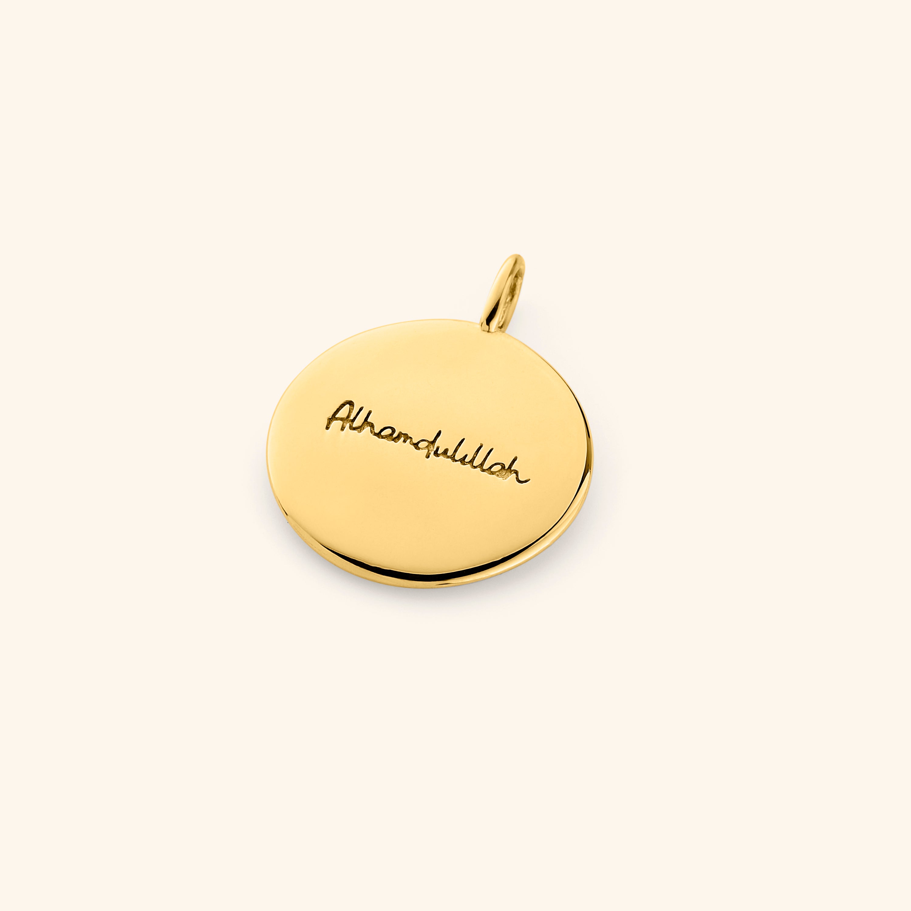 Alhamdulillah charm displayed in a velvet pouch, highlighting its thoughtful packaging.