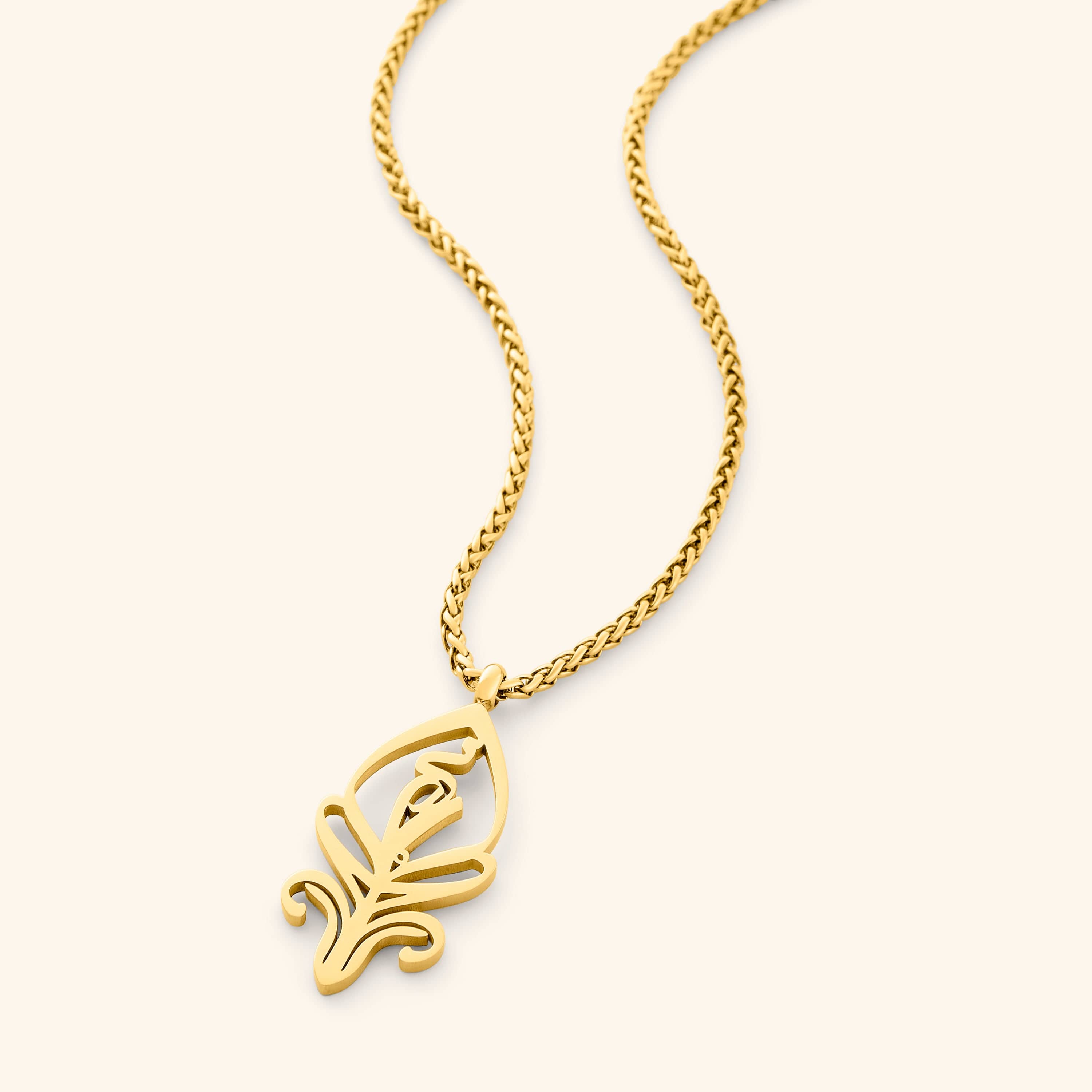 Close-up of the SALAAM Arabic calligraphy necklace showcasing its intricate design.