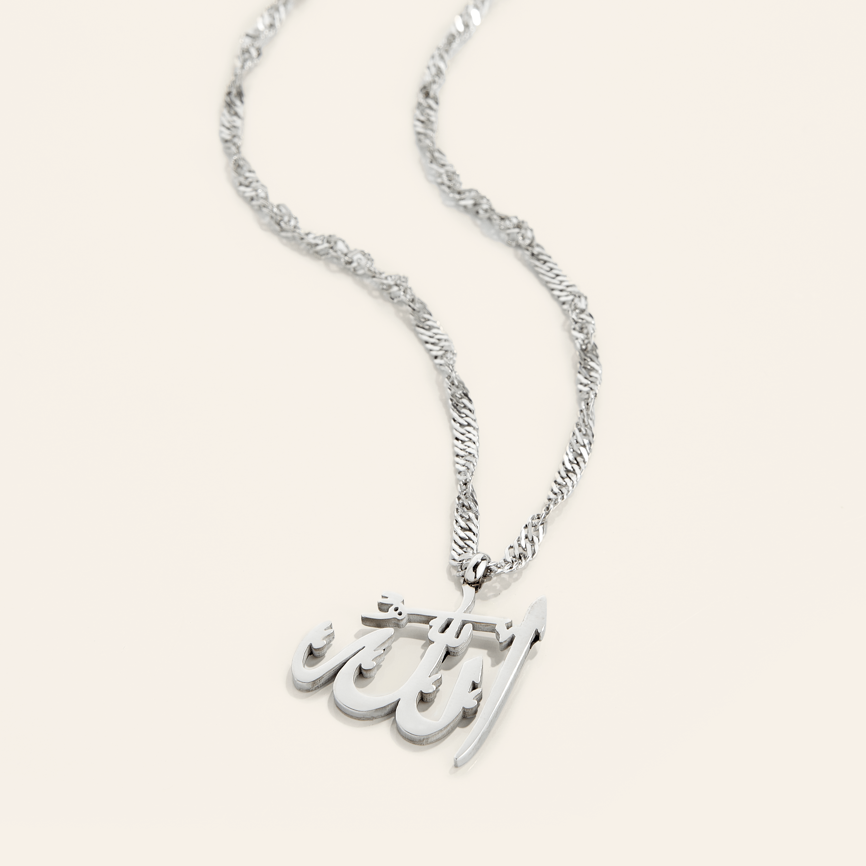 Elegant display of the Allah pendant necklace in its velvet drawstring pouch.