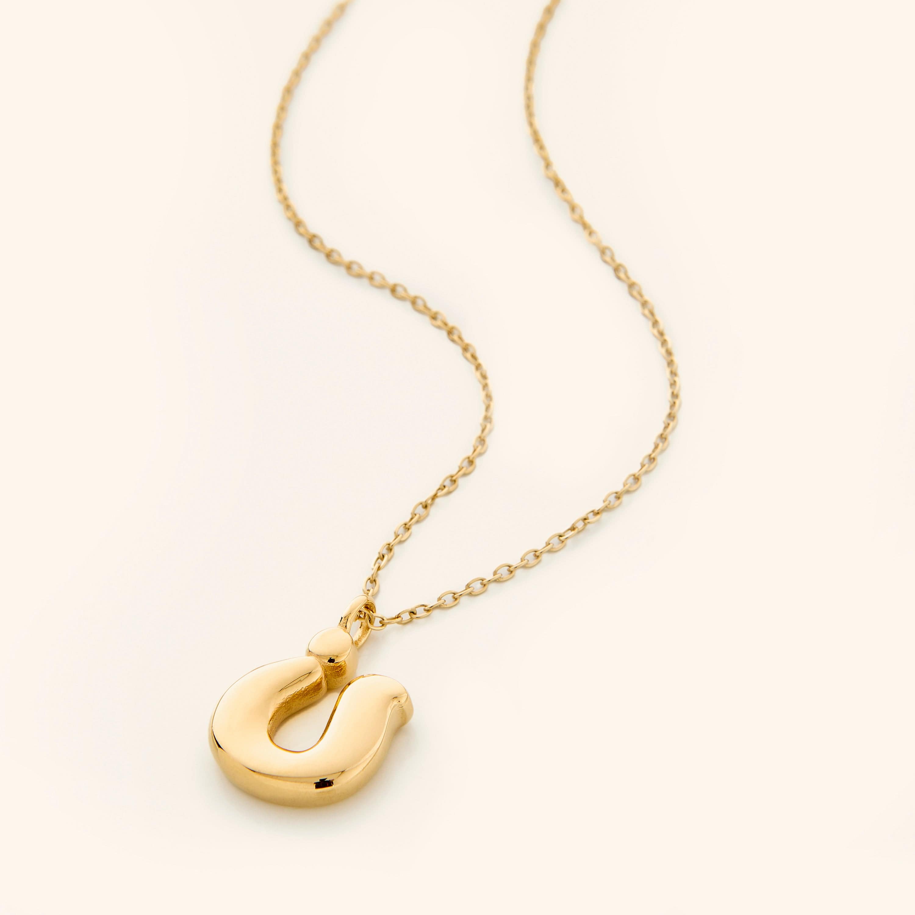 Personalized Arabic bubble letter necklace worn elegantly at a 22-inch length.