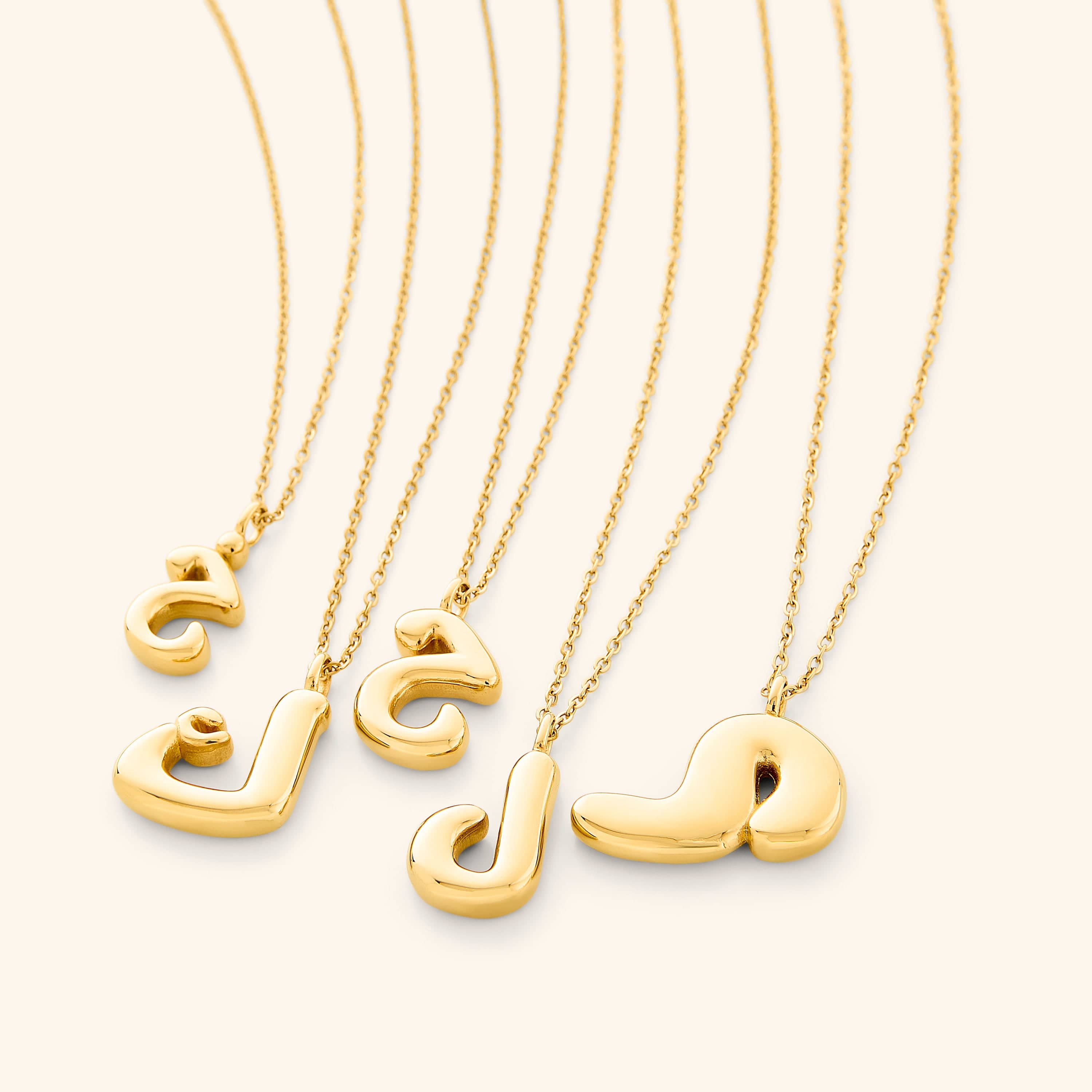 Personalized Arabic bubble letter necklace worn elegantly at a 22-inch length.