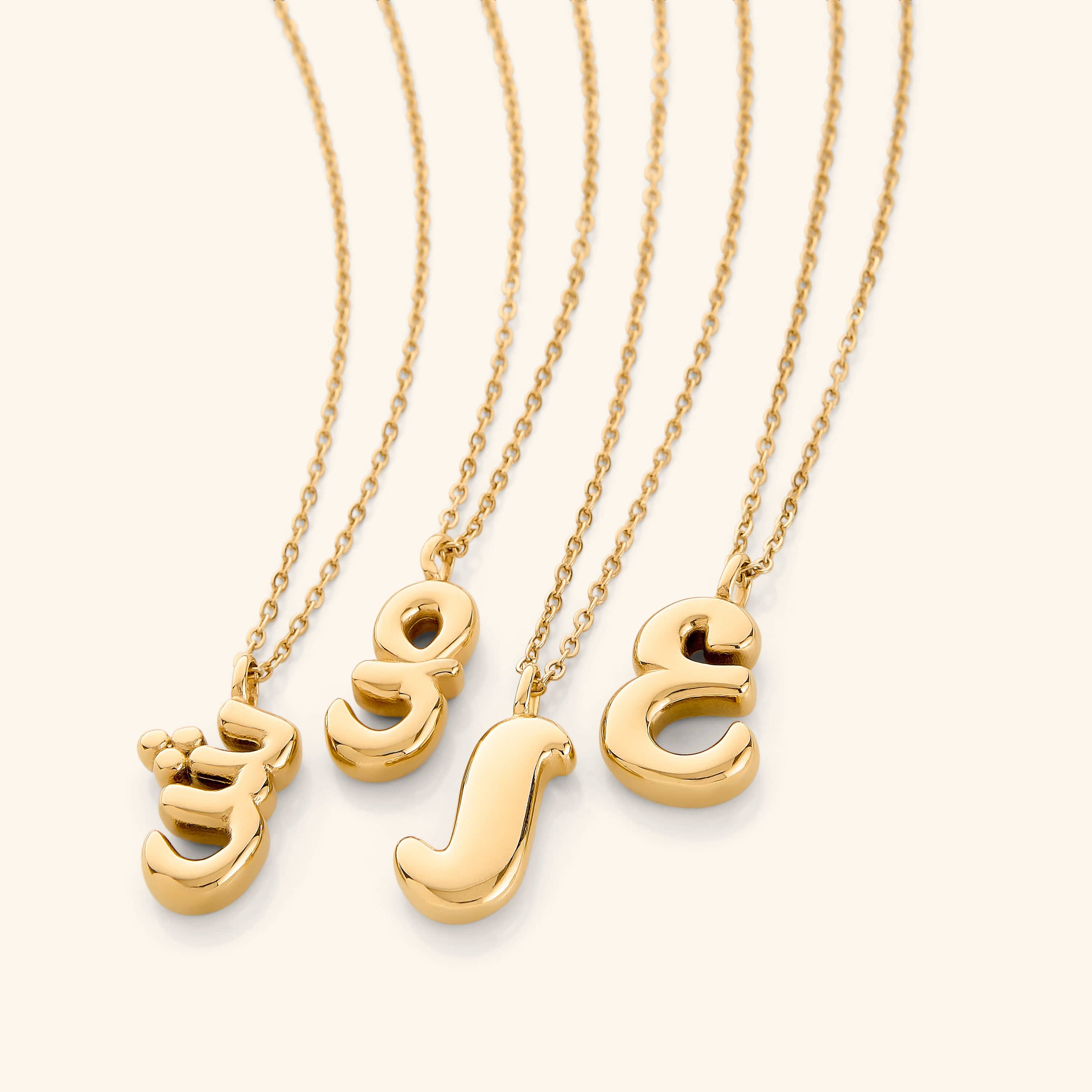 Personalized Arabic bubble letter necklace worn elegantly at a 22-inch length.