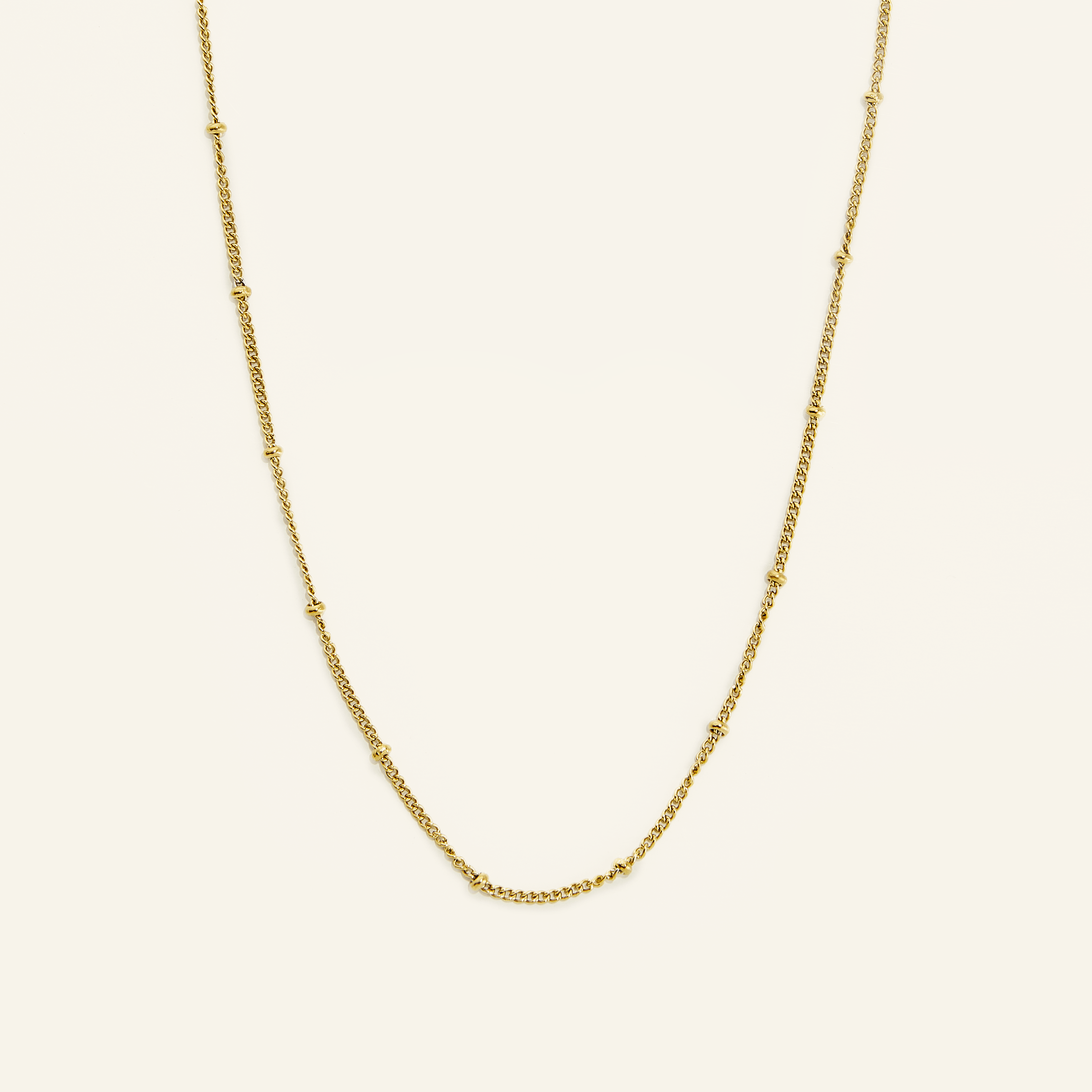 Elegant Dotted Gold Chain Necklace displayed on a model, emphasizing its minimalist appeal.