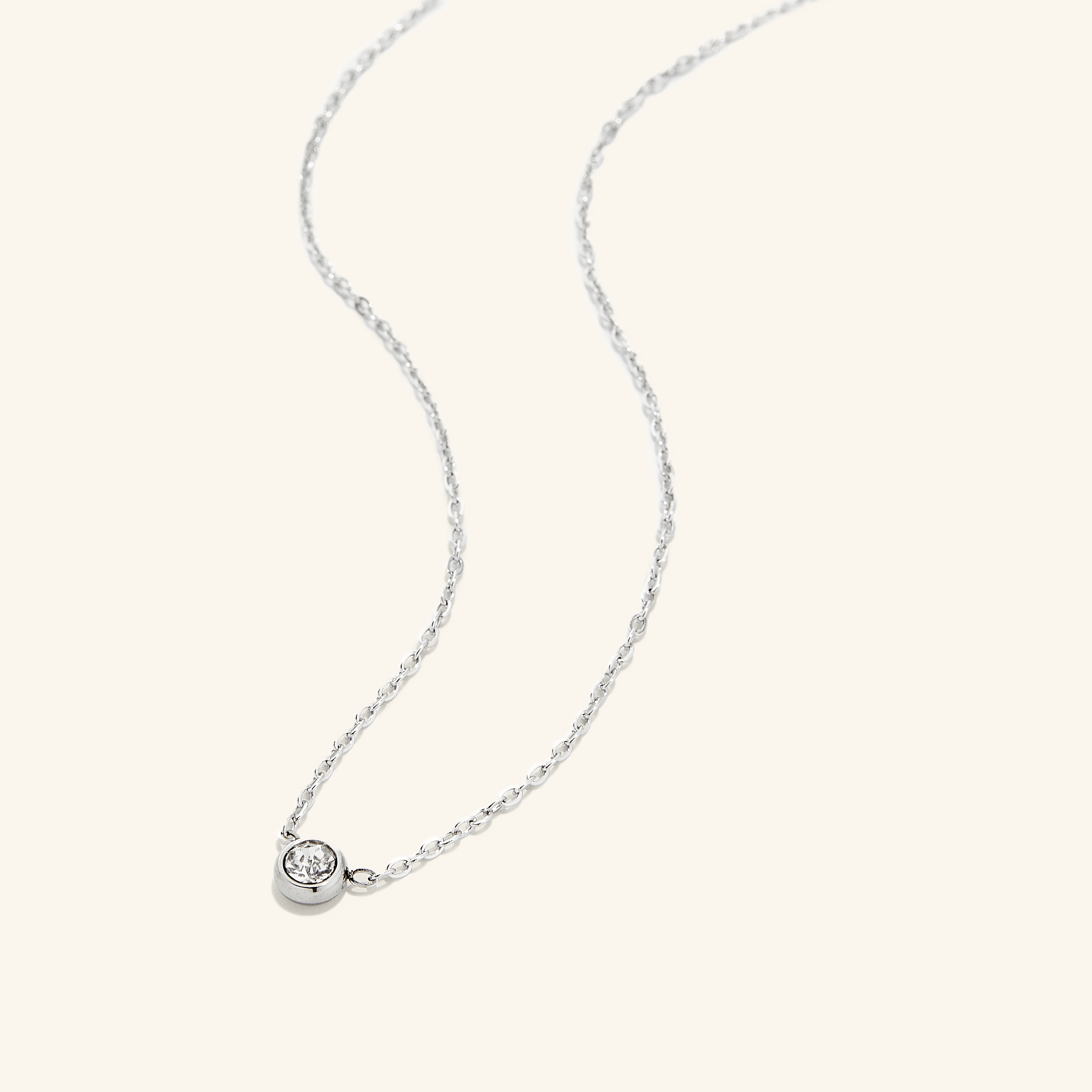 Necklace laid on a velvet pouch, demonstrating its luxurious packaging and premium quality.