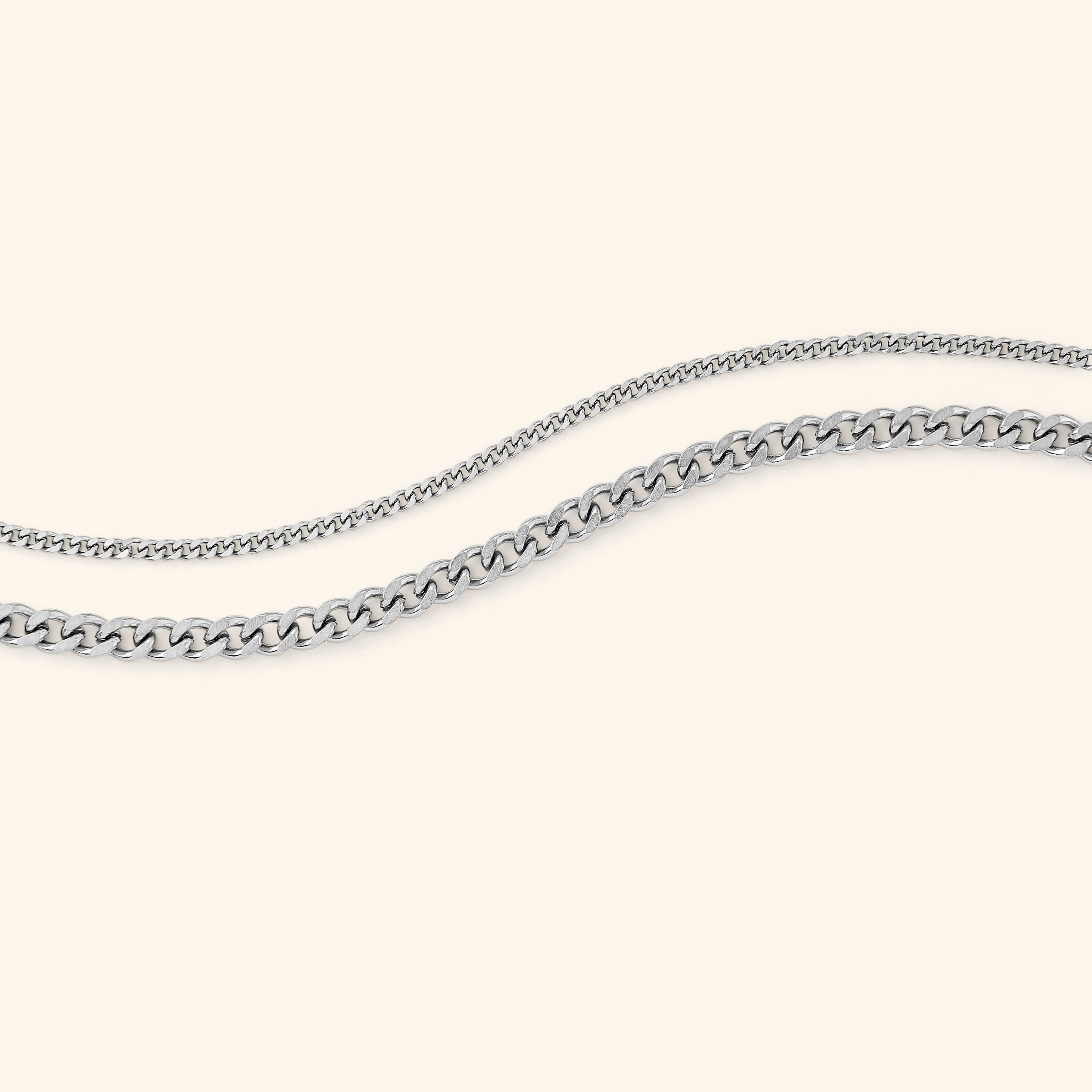 Close-up of the elegant gold curb chain bracelet showcasing its uniform link design.
