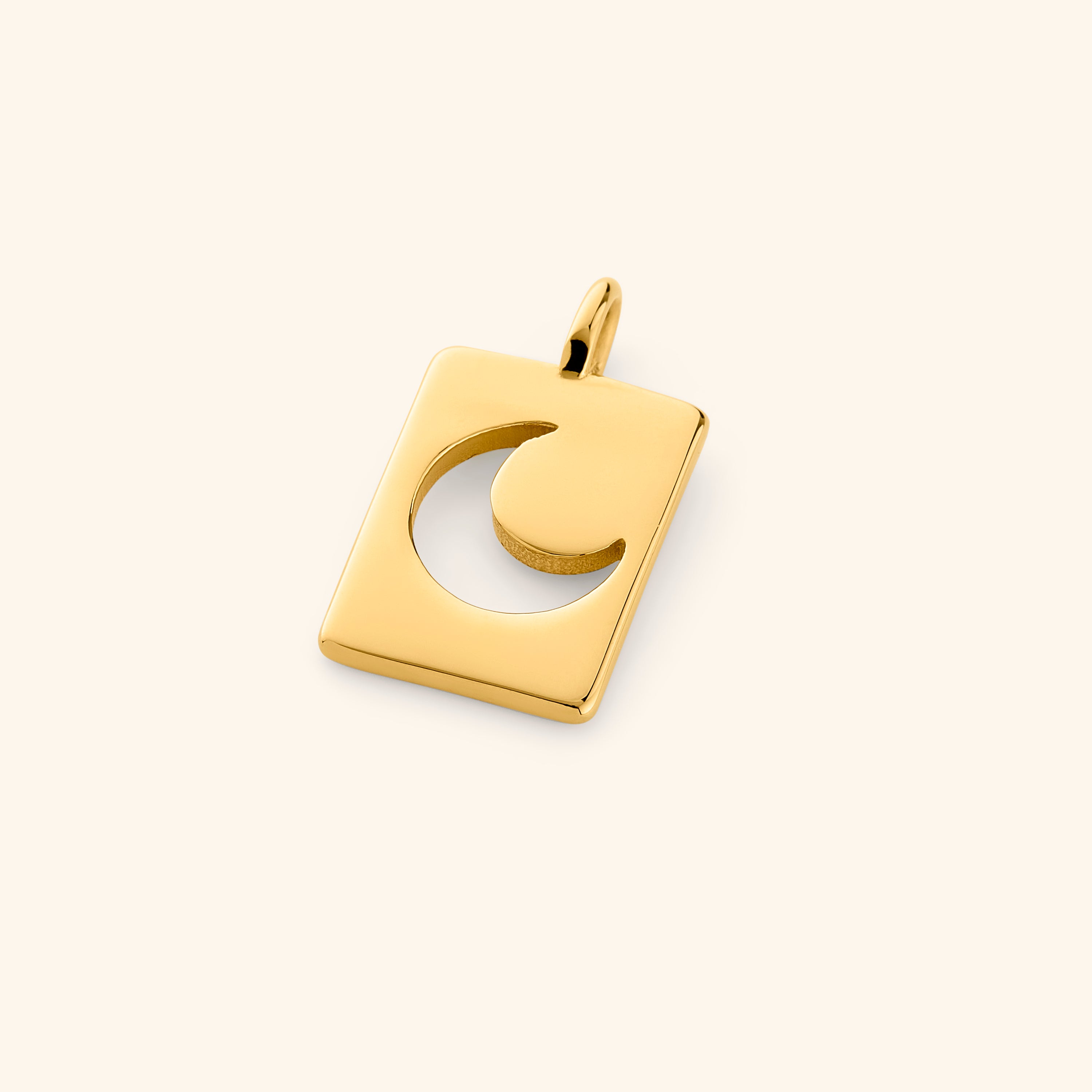 Close-up view of the Celestial Crescent Moon Charm showcasing its gold finish and design.