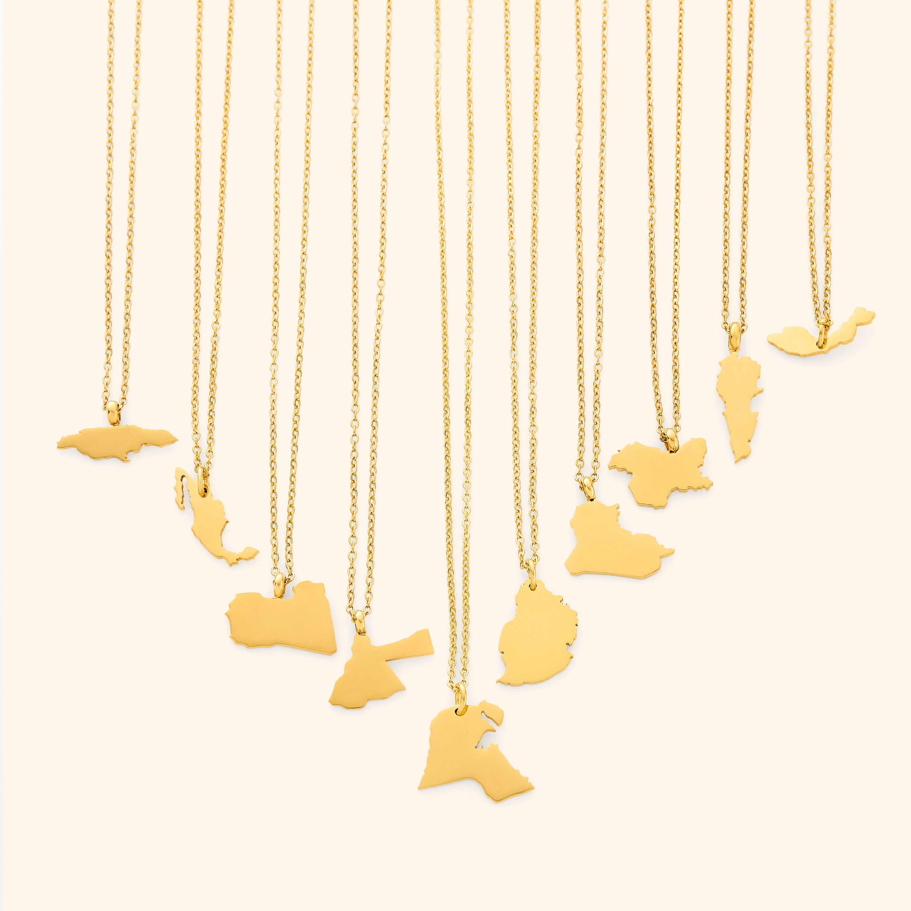 Close-up of the personalized country map necklace showcasing its intricate design and gold finish.